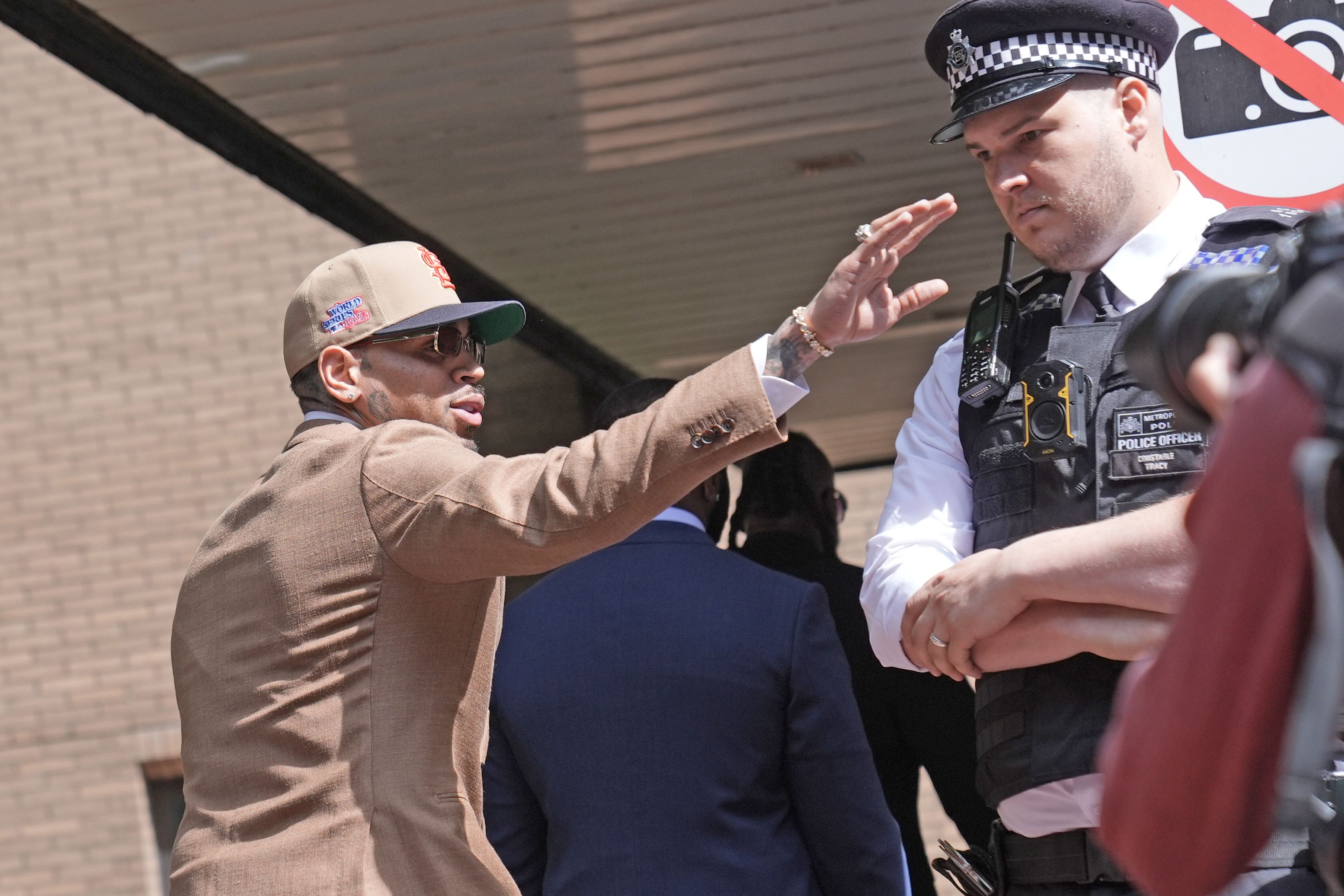 R&B singer Chris Brown waved to fans as he arrived at Southwark Crown Court