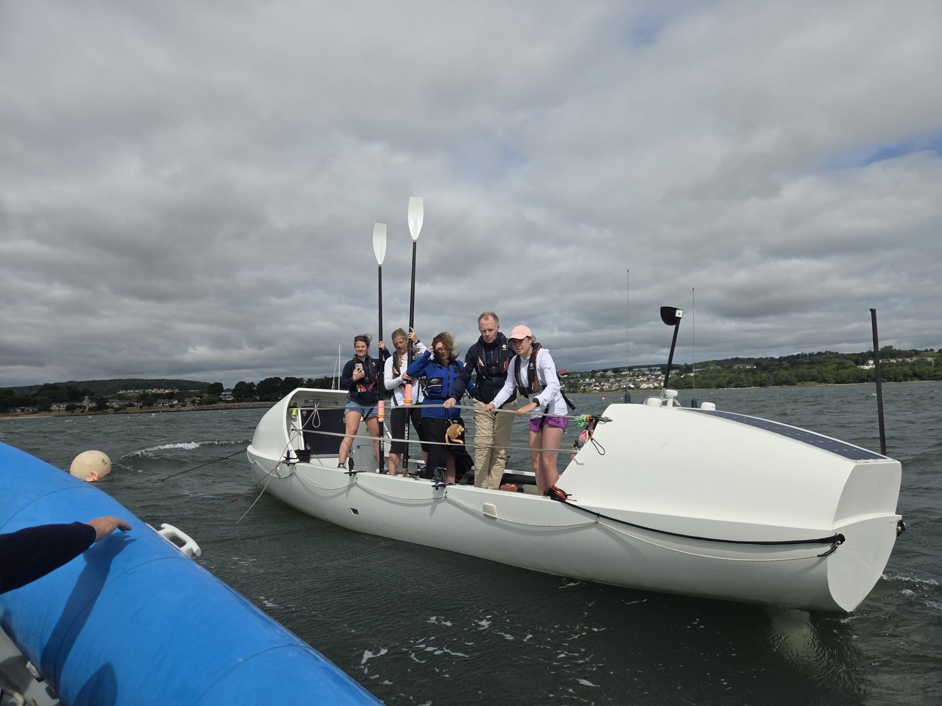 Lauren Wilde-Arnold, Doctor Jenna Volpert, Rebecca Duncan, business development and fundraising manager for Archie Foundation in Tayside, James Emmett, CEO of MKS PAMP, and Ellen Clark were on board the boat that will take Ellen, Lauren, and Jenna across the Atlantic later this year (PA)