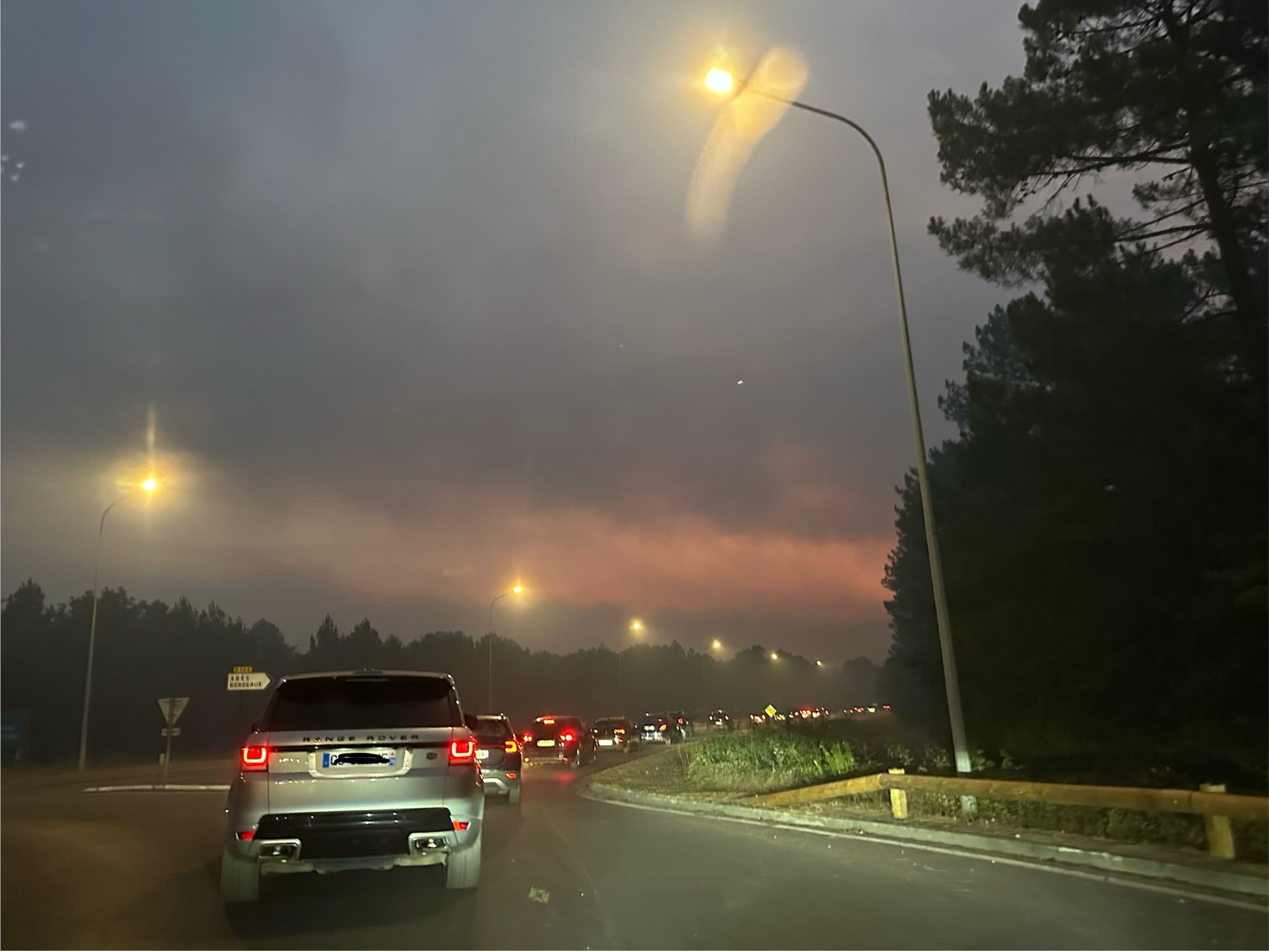Smoke filled the roads out of the town as residents fled in the middle of the night