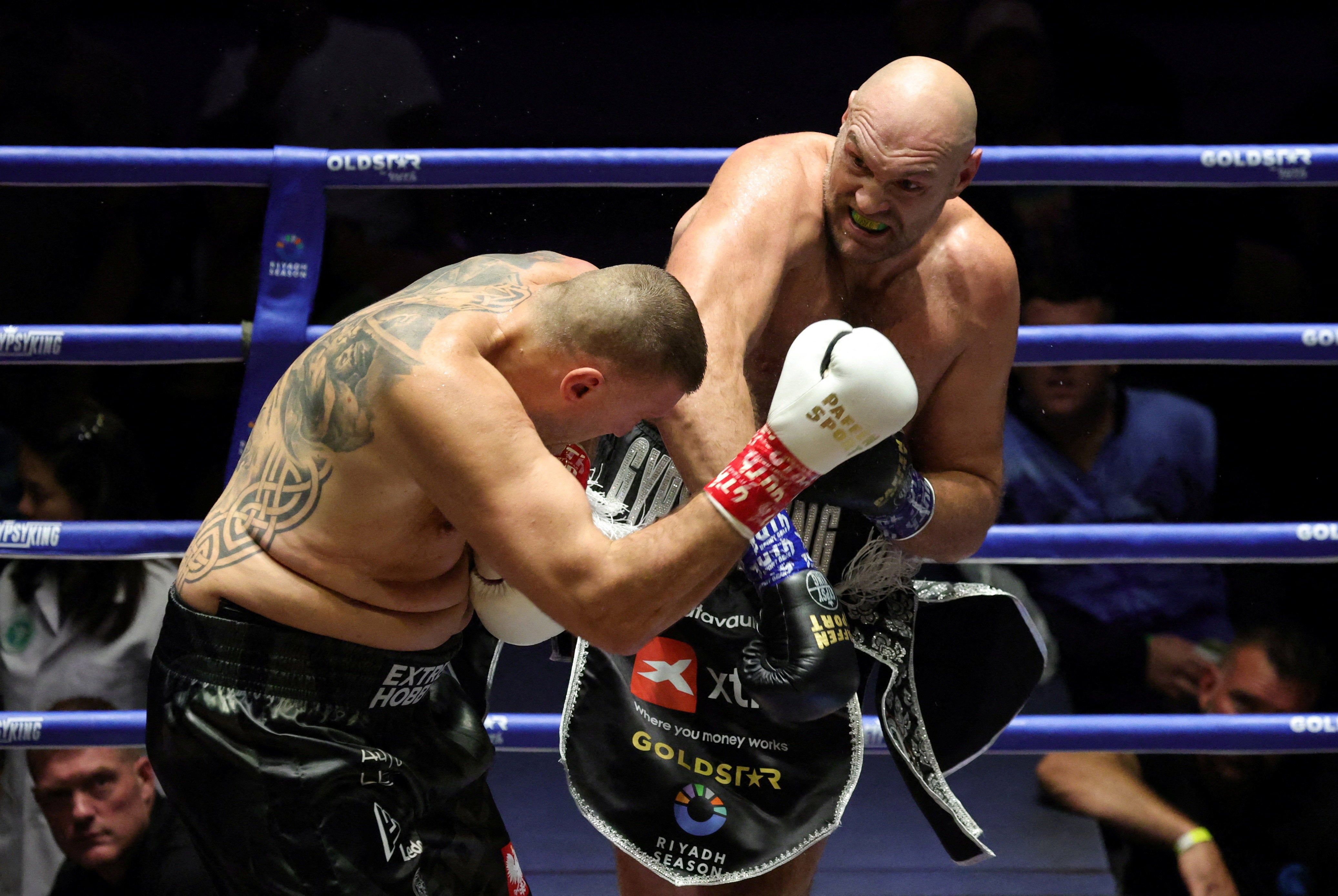 Tyson Fury (right) during his win over Mariusz Wach in Thailand (Reuters)