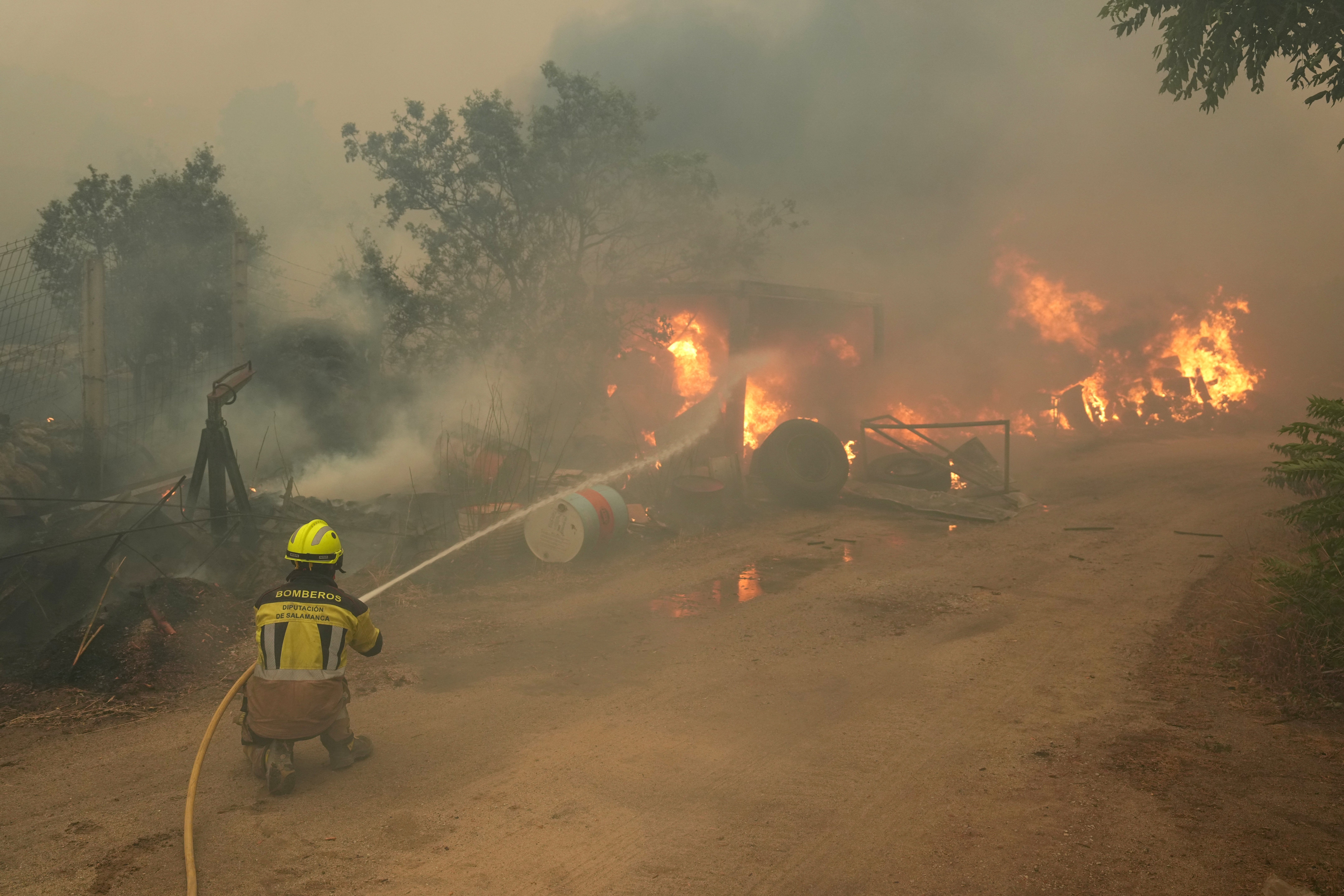 Firefighters battle a wildfire in Cebreros area, near Avila, 80 kms west of Madrid on July 24, 2026