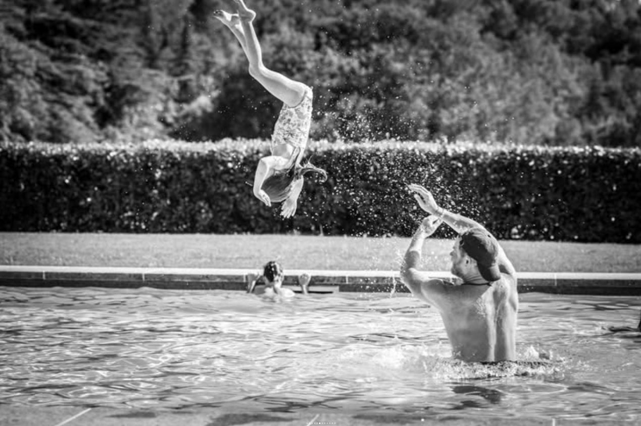 Prince Harry throws Princess Lilibet into the swimming pool in family summer holiday photos