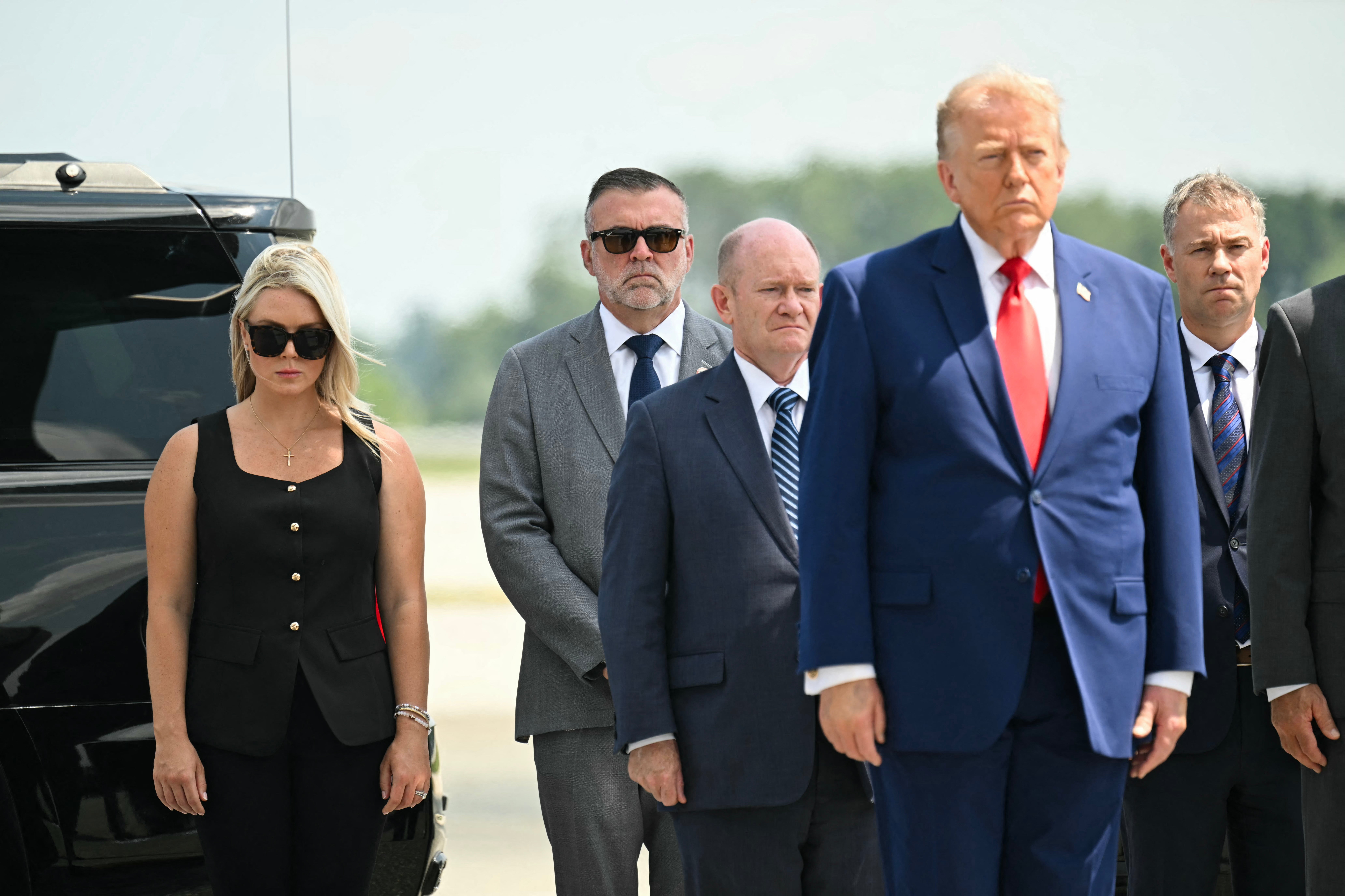 US president Donald Trump, alongside White House press secretary Karoline Leavitt and US senator Chris Coons, Democrat from Delaware, attend a dignified transfer solemn event for US service members killed during operations in the Middle East (AFP/Getty)