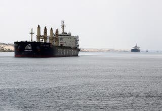 File: Ships move through the Suez Canal, in Ismalia, Egypt, 31 July 2025