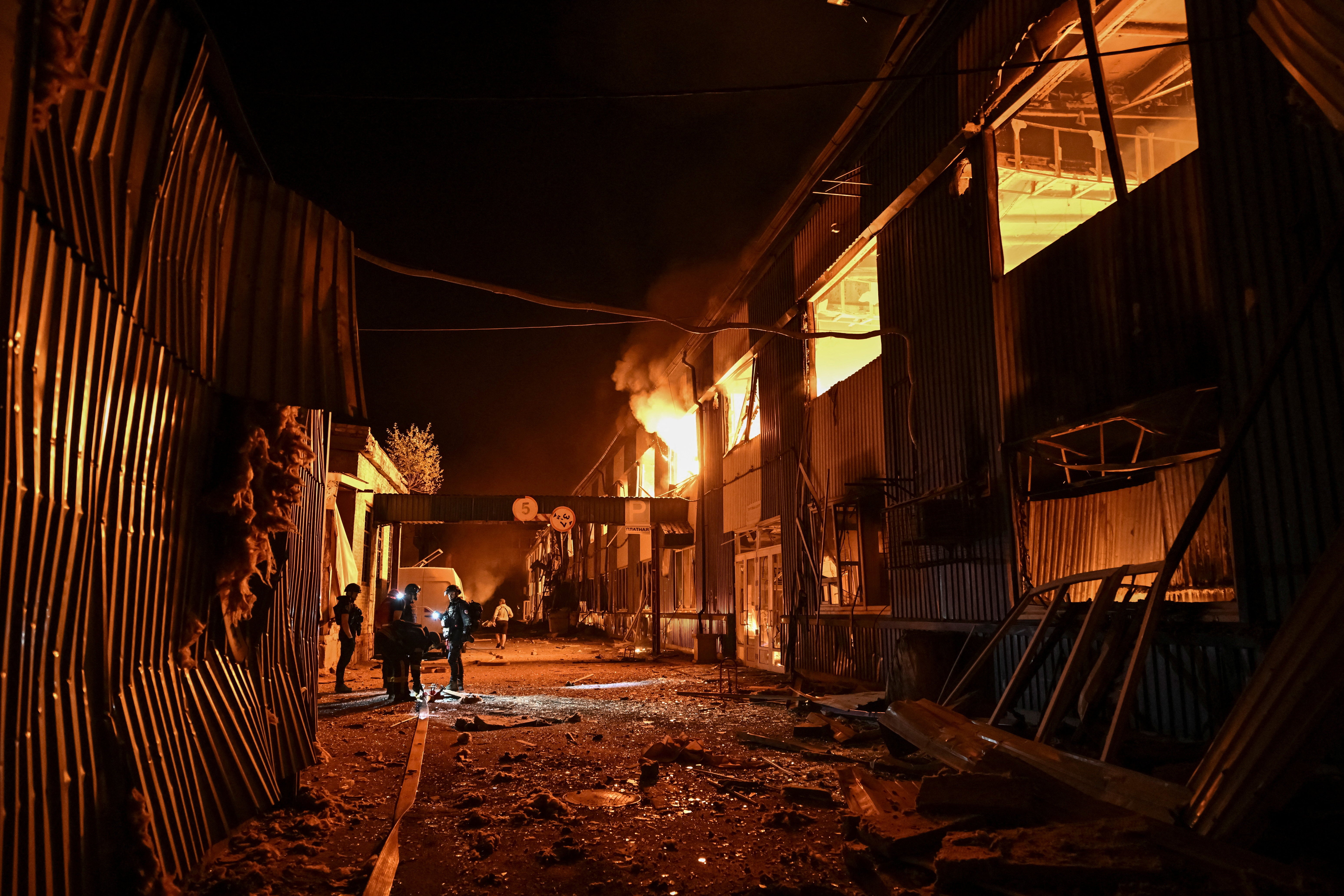 Rescuers work at a site of the central market hit by Russian drone strike, amid Russia's attack on Ukraine, in Zaporizhzhia, Ukraine July 25, 2026. (Reuters)