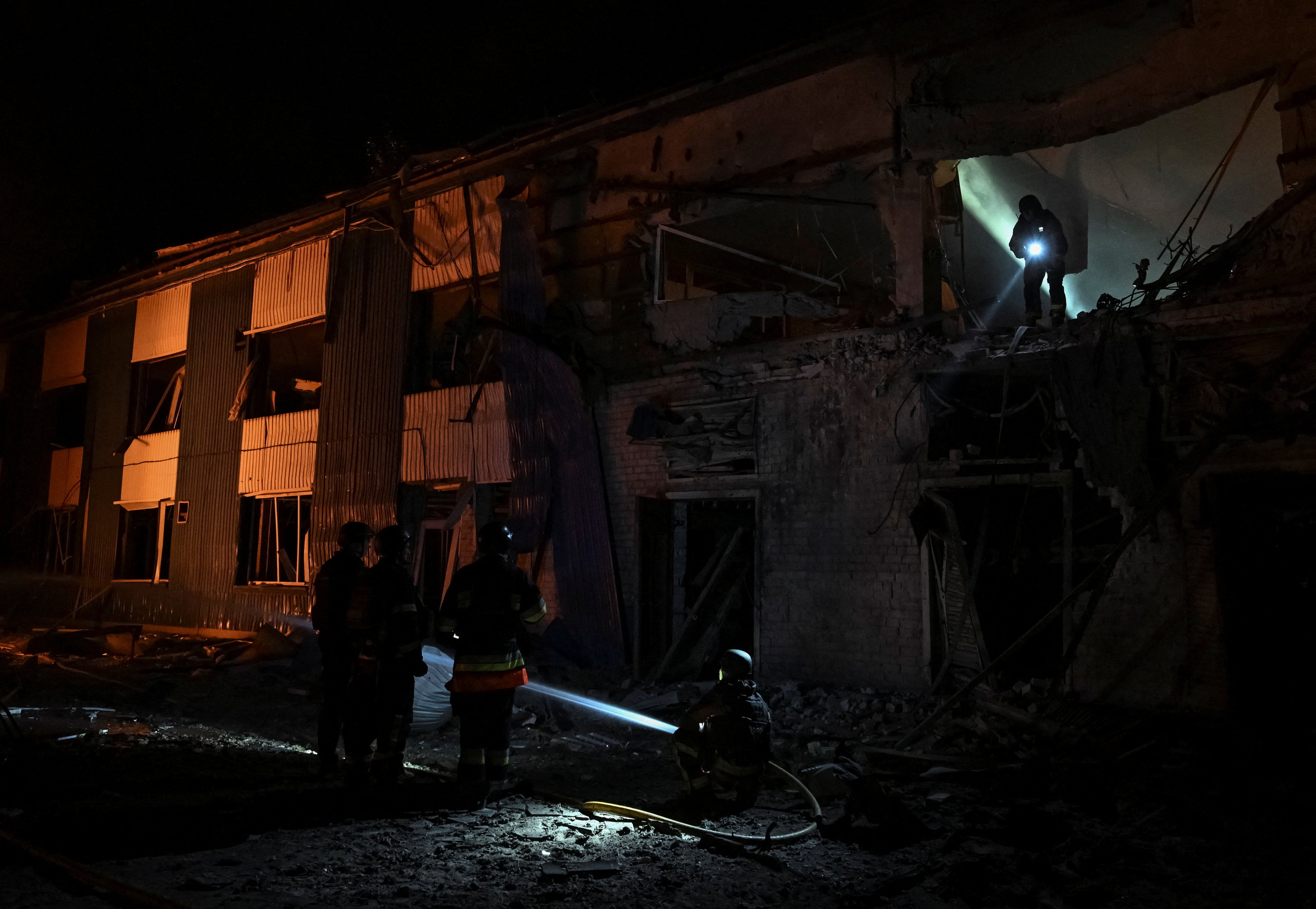 Rescuers work at a site of the central market hit by Russian drone strike, amid Russia's attack on Ukraine, in Zaporizhzhia, Ukraine July 25, 2026. (Reuters)