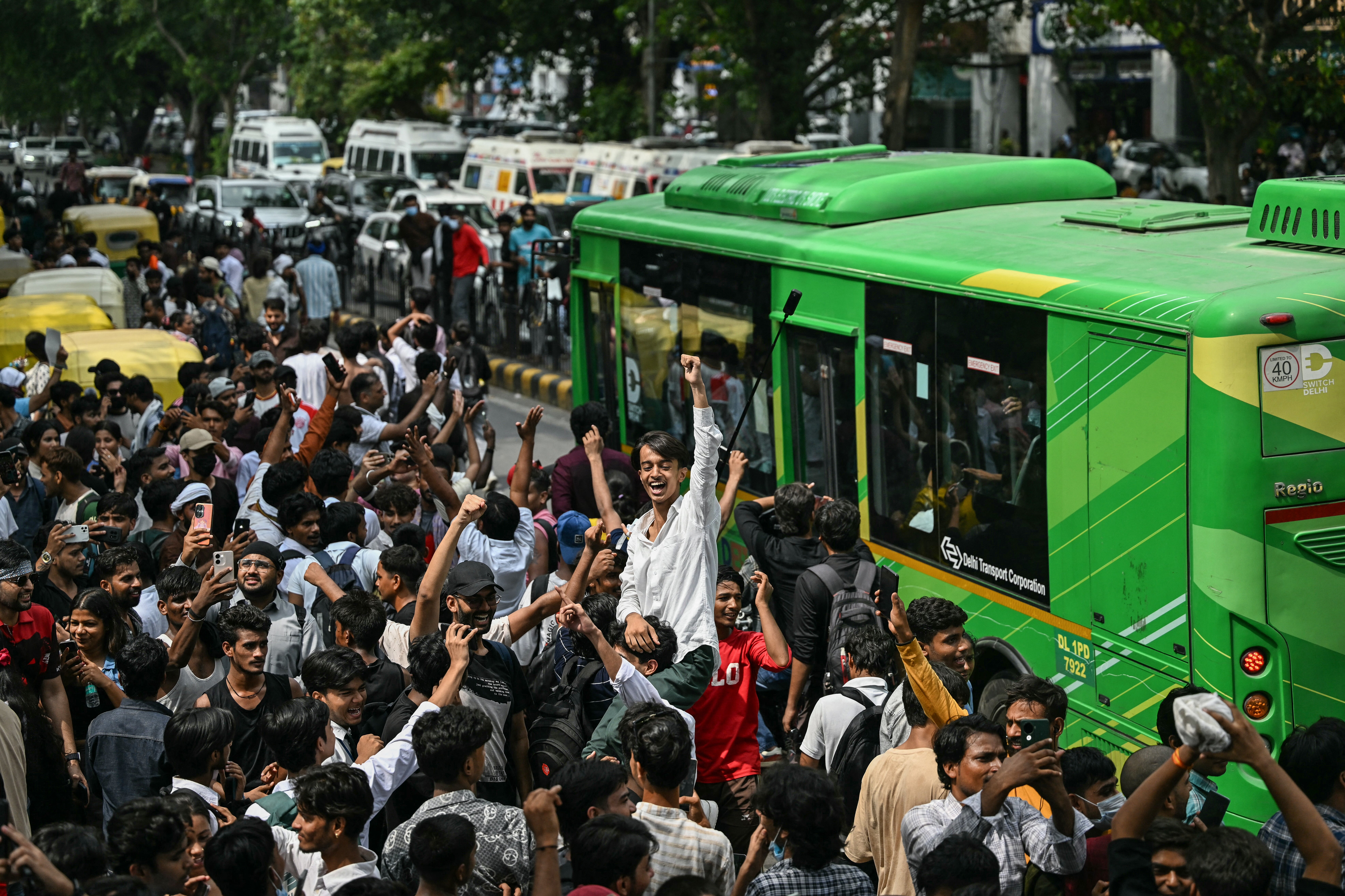 Cockroach Janta Party (CJP) supporters celebrate the resignation of India’s education minister Dharmendra Pradhan, at Jantar Mantar in New Delhi