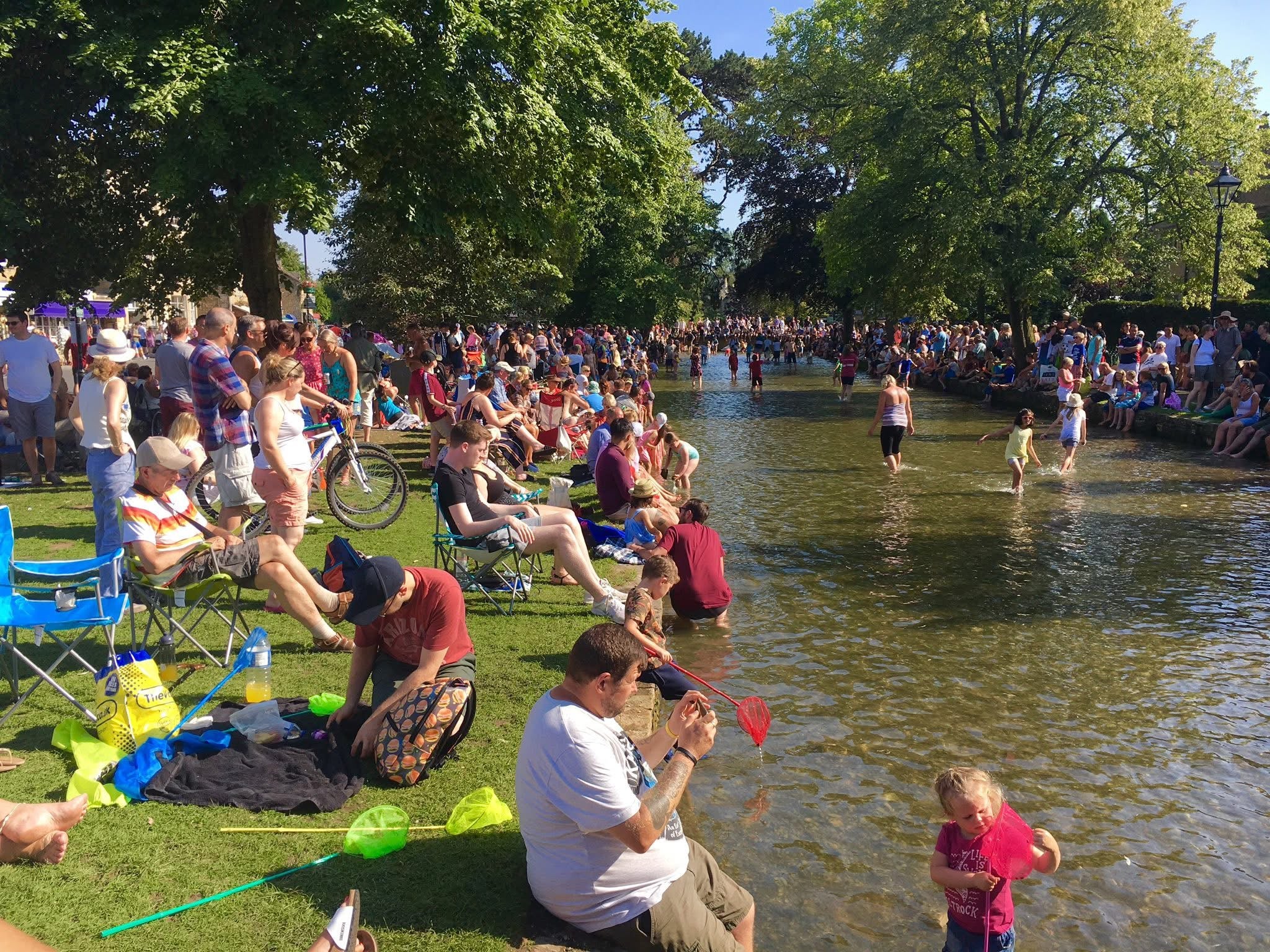 Bourton-on-the-Water's beautiful river attracts millions of tourists in the hot weather