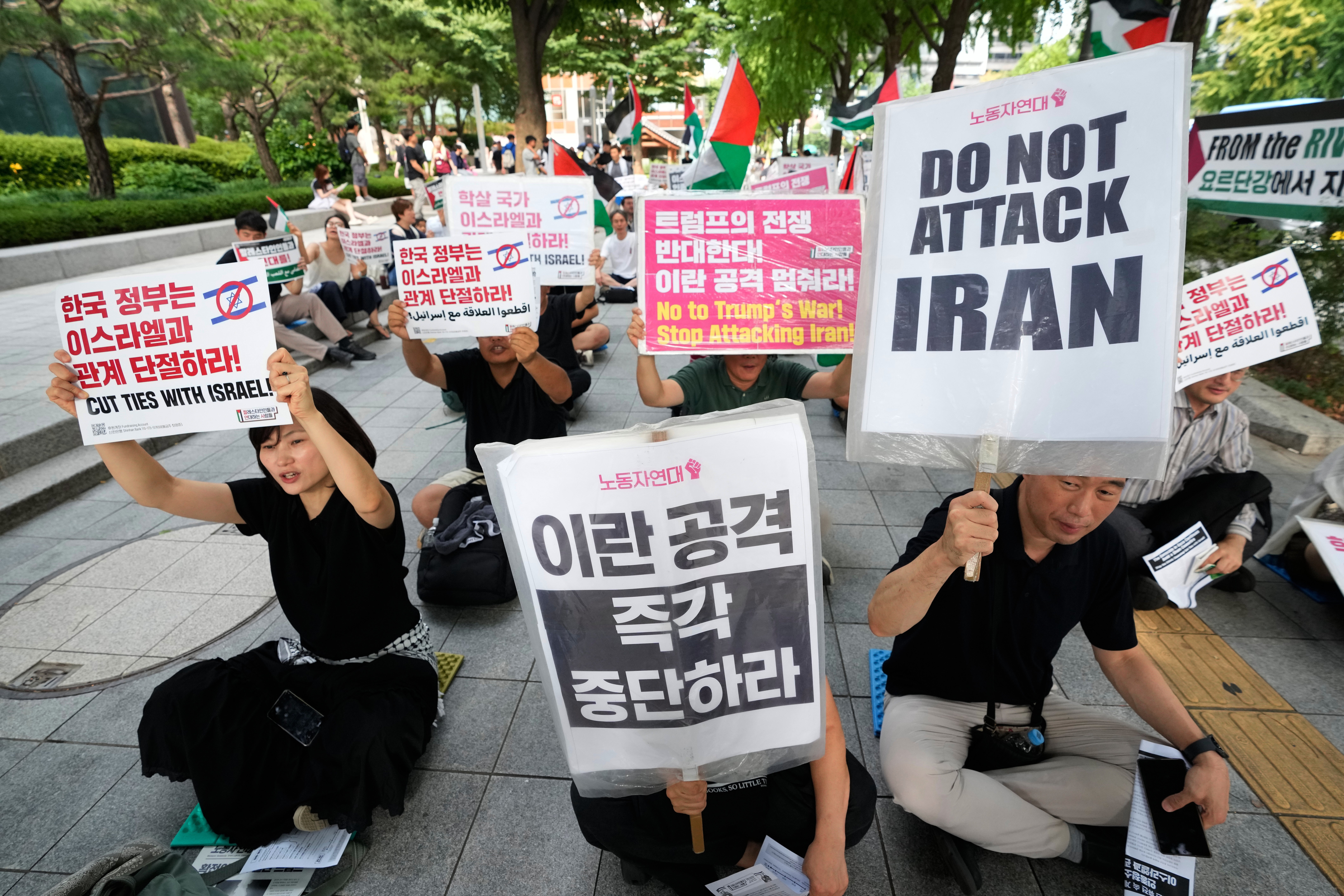 Members of the People in Solidarity with Palestinians stage a rally denouncing the U.S. attacks on Iran in Seoul (AP)