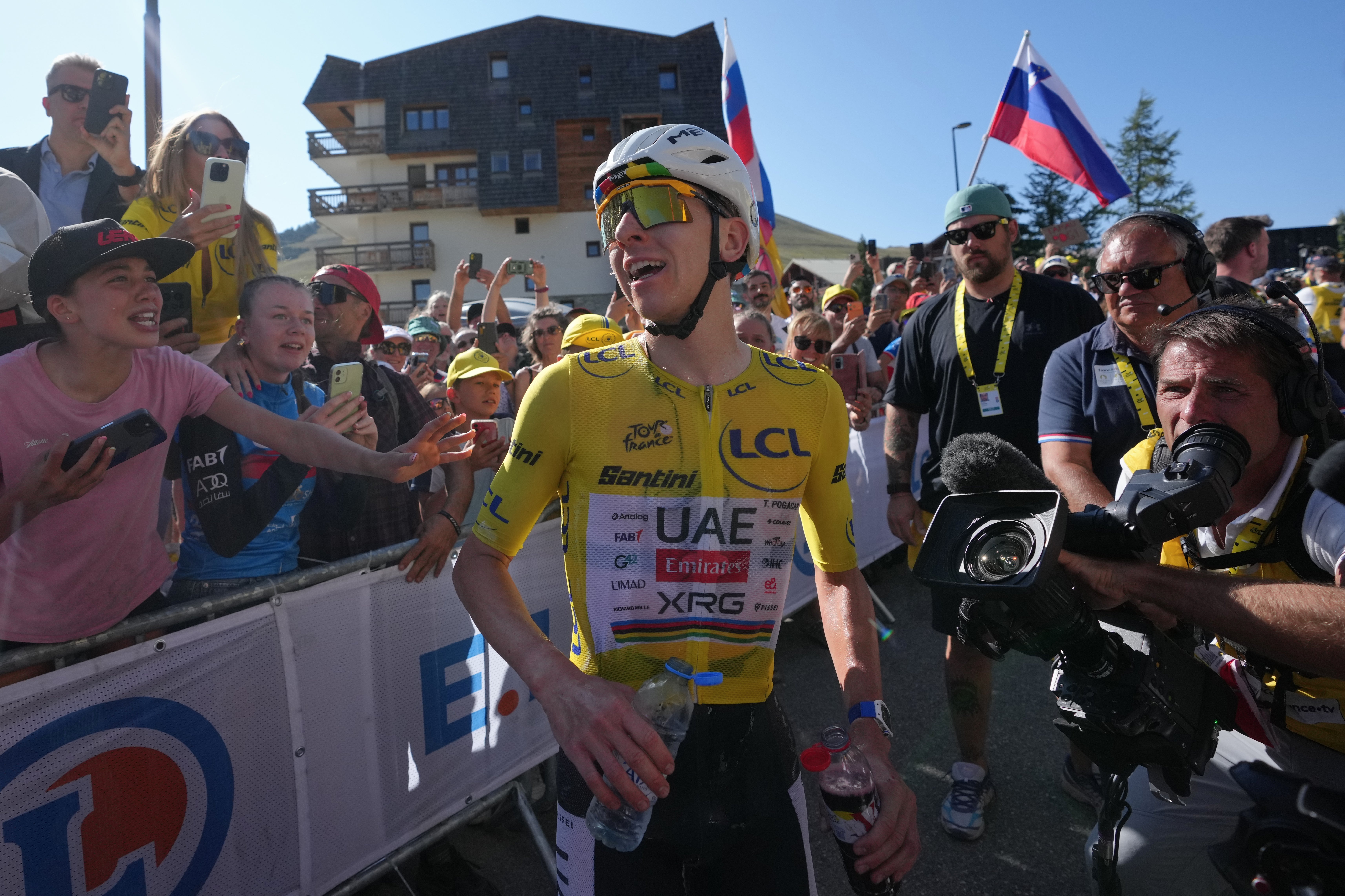 Tadej Pogacar celebrates wining stage 19 of the Tour de France