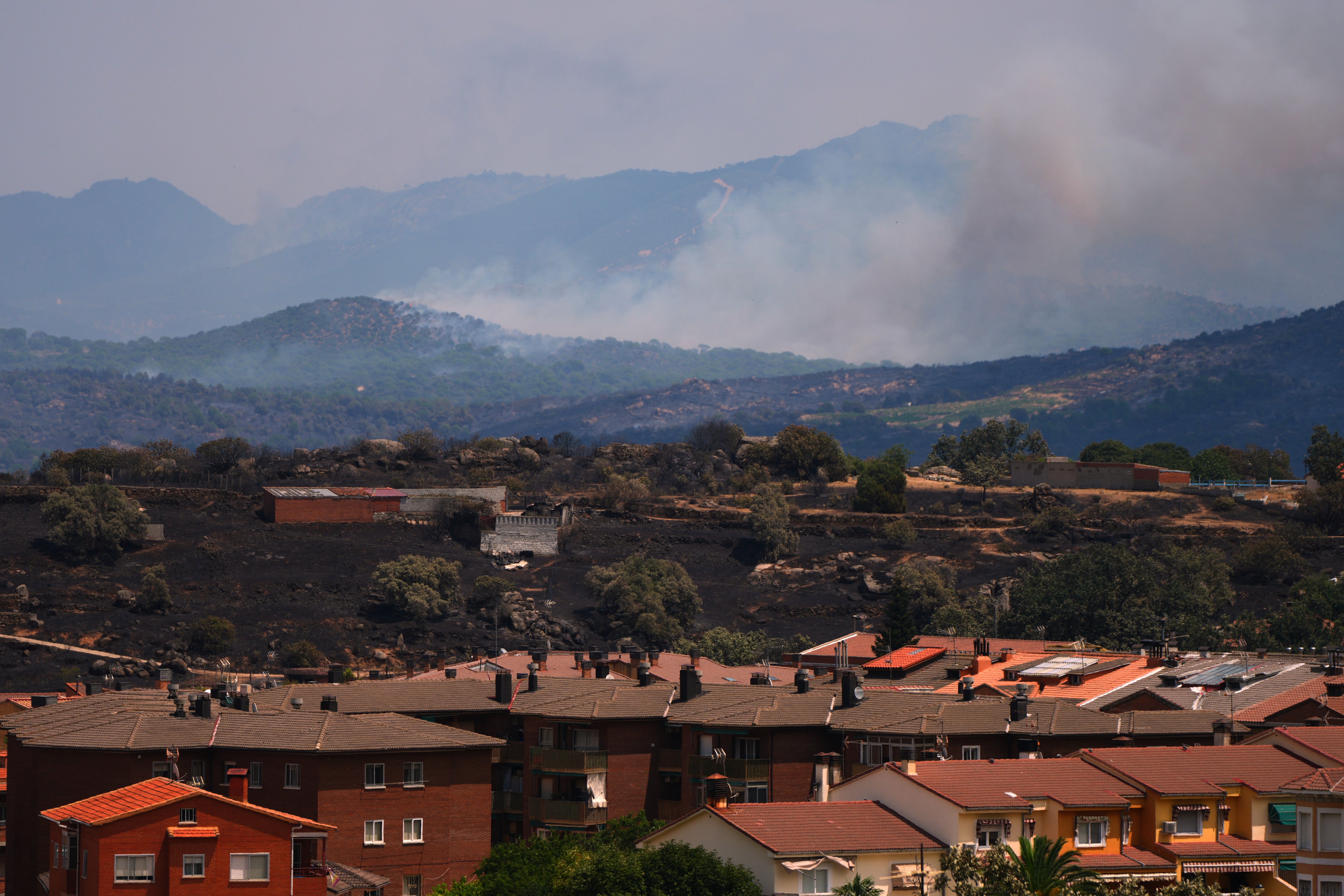 Smoke rises as a wildfire advances near El Tiemblo, Madrid province, Spain