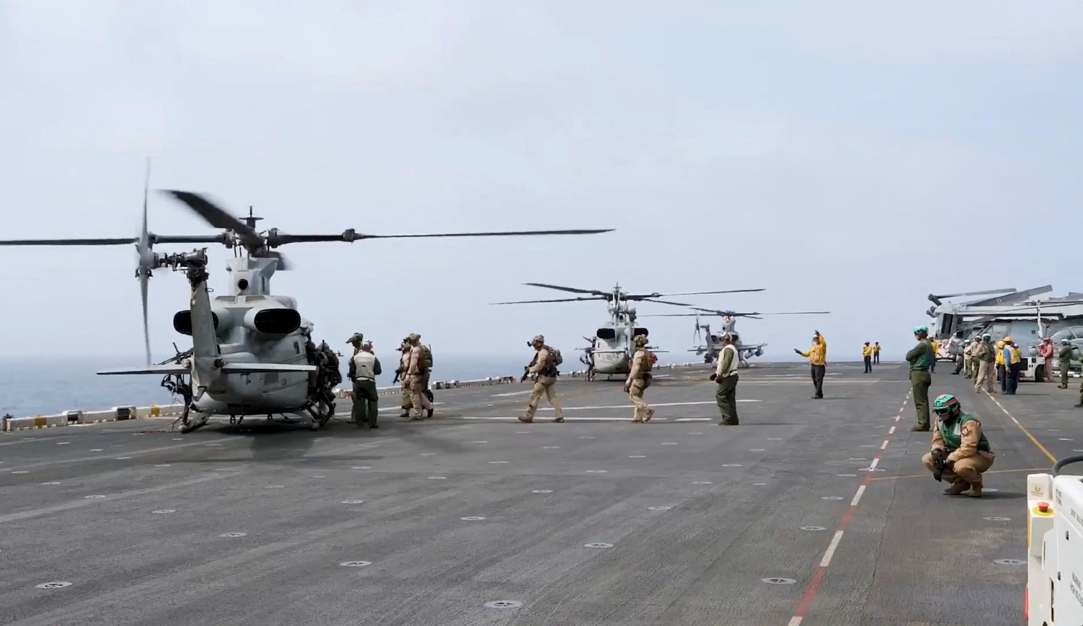 Military helicopters and personnel operate in a location given as the Arabian Sea in this screengrab obtained from a video released by U.S. Central Command (CENTCOM) on July 25, 2026. (Reuters)