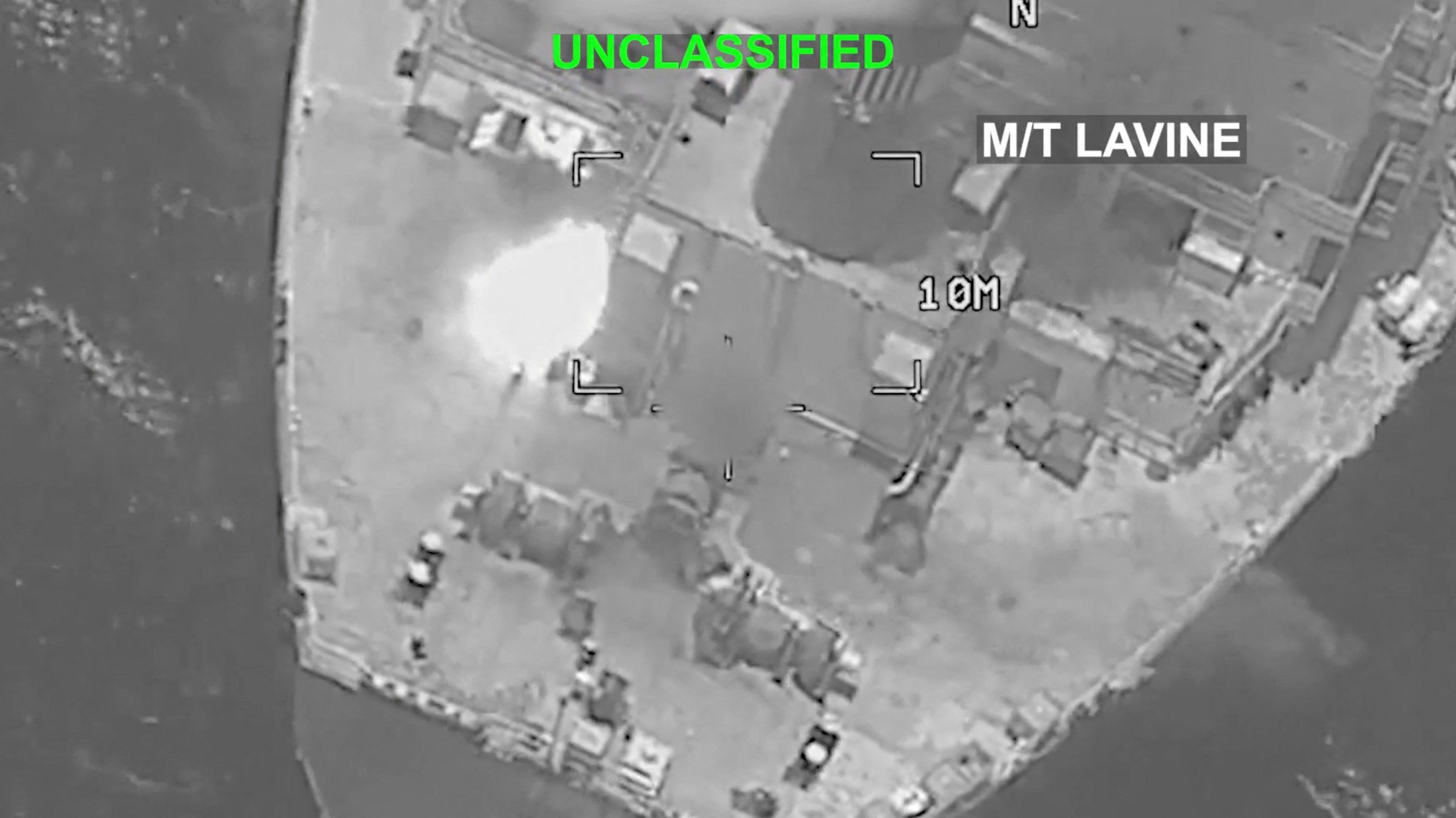 A bright flash is visible on the deck of the Mozambique-flagged tanker M/T Lavine in a location given as the Gulf of Oman in this screengrab obtained from a video released by US Central Command on 25 July 2026 (Reuters)