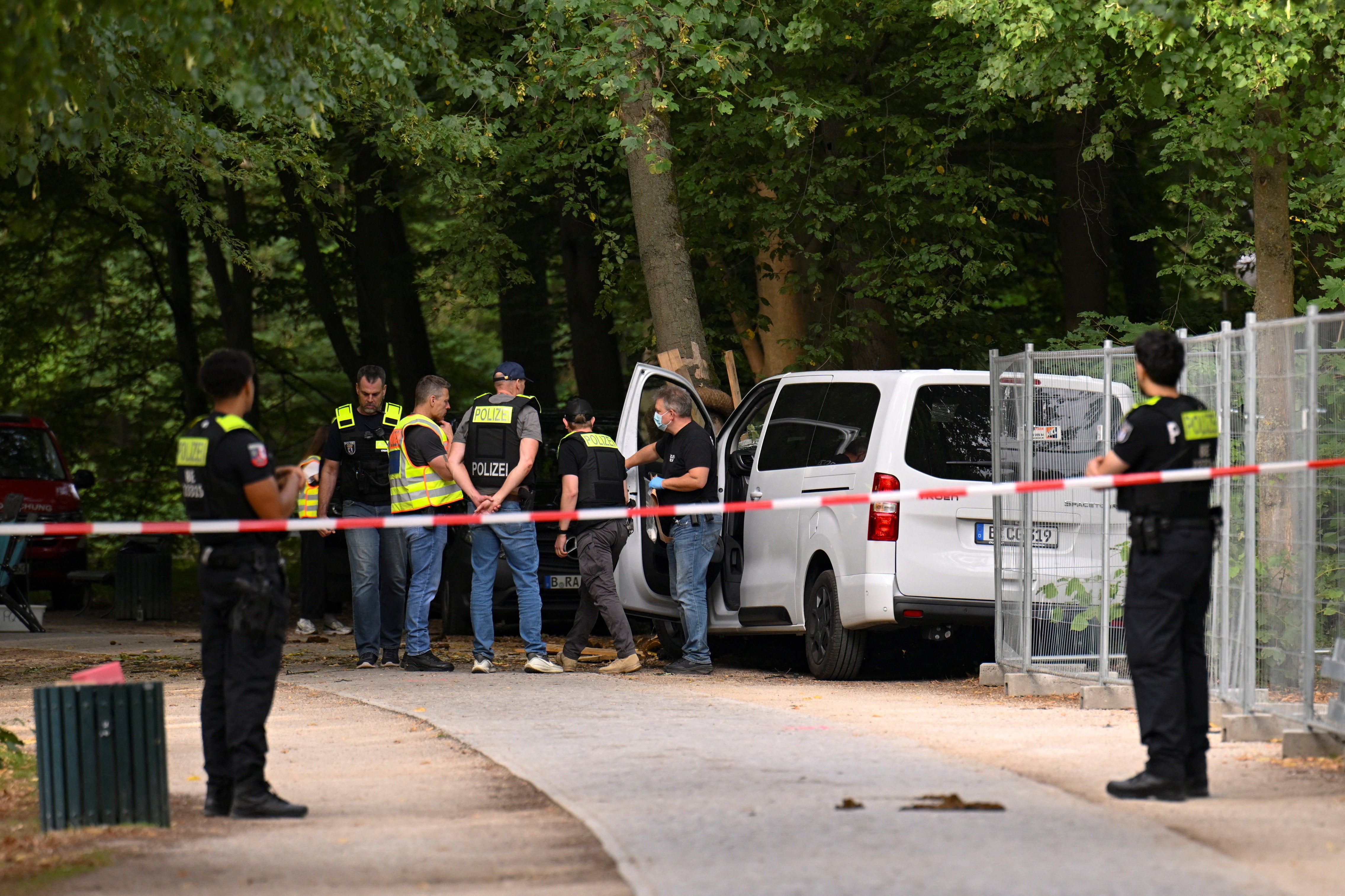 Police inspect a vehicle which crashed into a crowd near Berlin's annual Christopher Street Day Pride parade on Saturday evening, leaving multiple people injured and the parade called off, in Berlin, Germany, July 26, 2026.