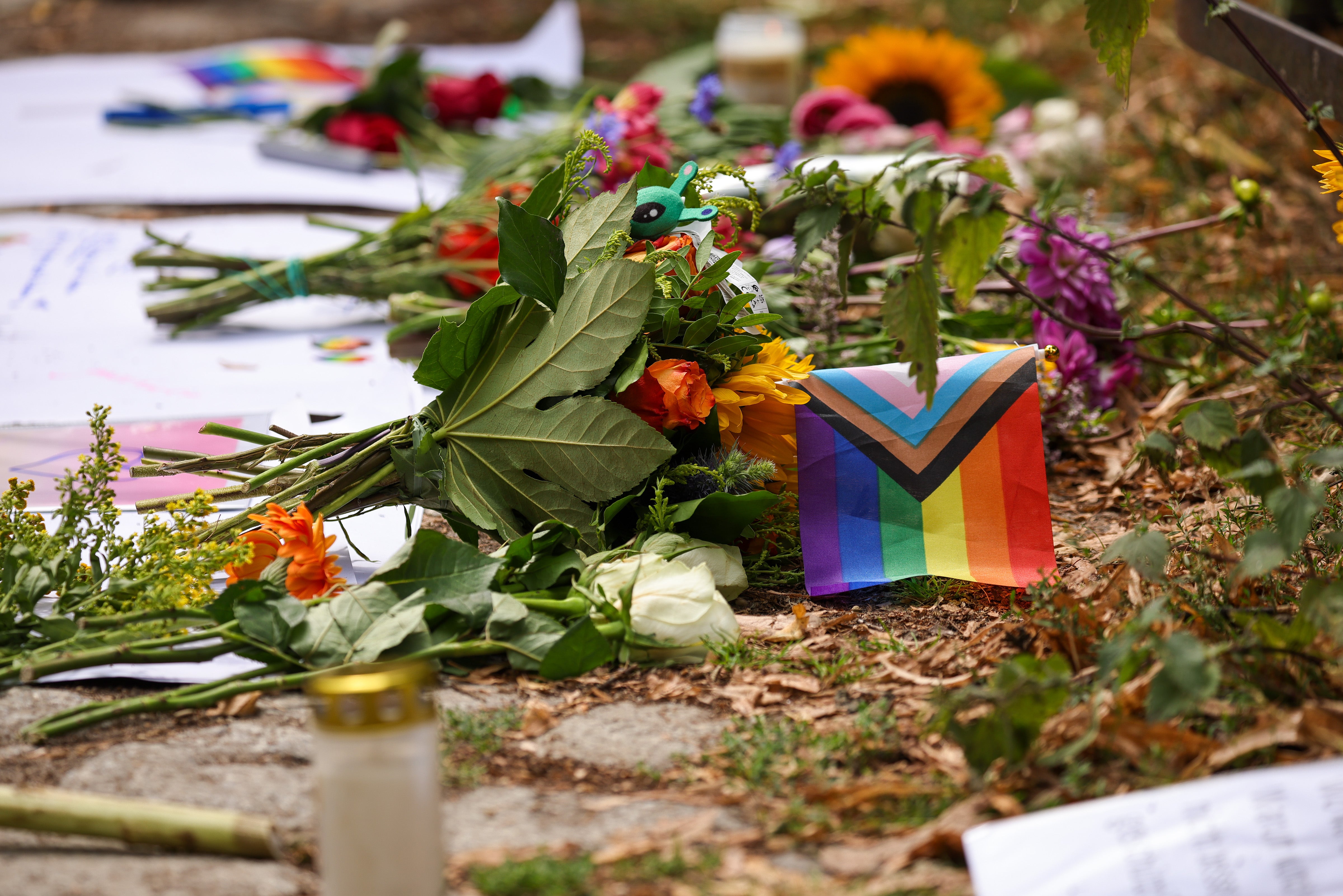 People have left flowers and messages of support at the scene of the attack
