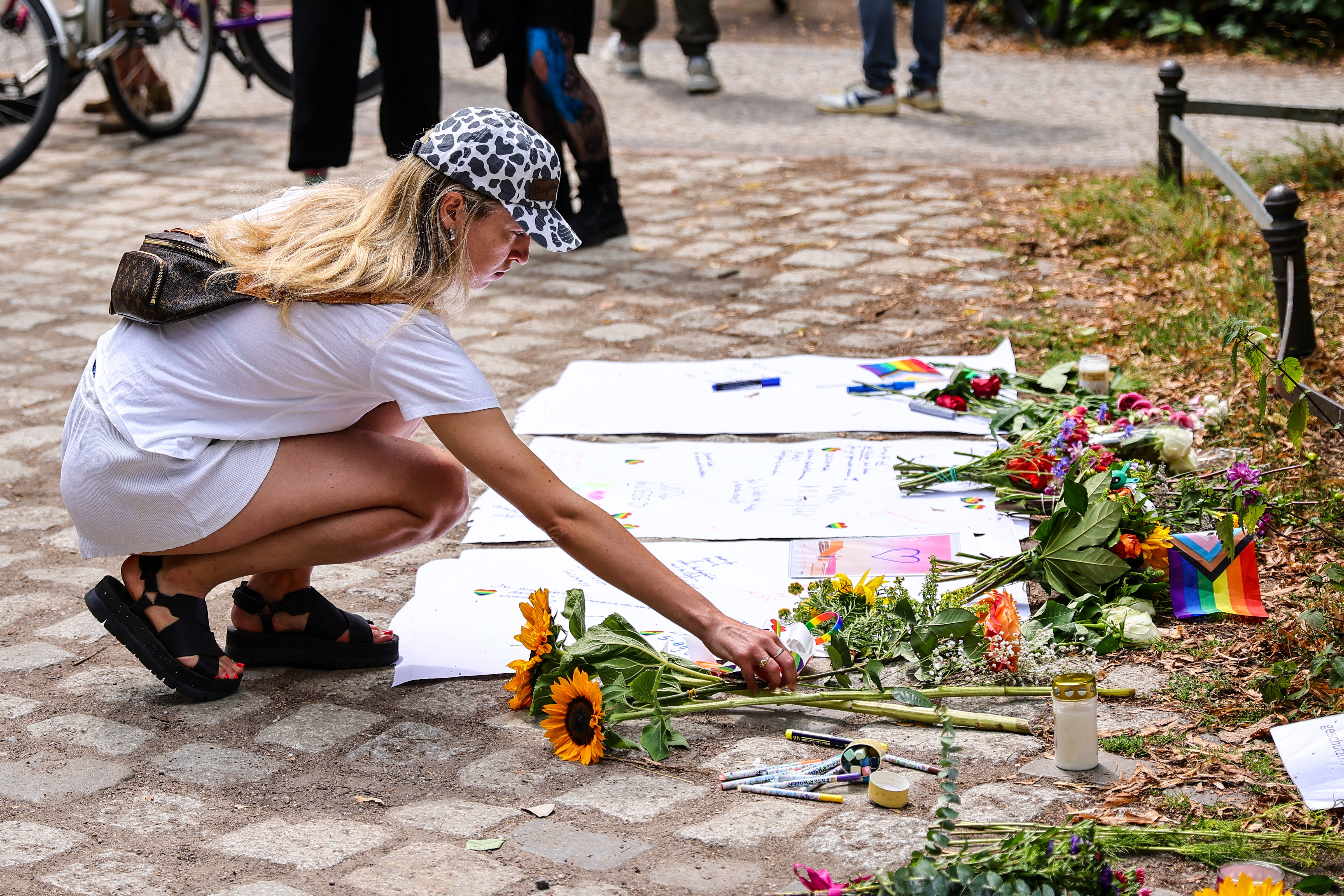 People have left flowers and messages of support at the scene of the attack