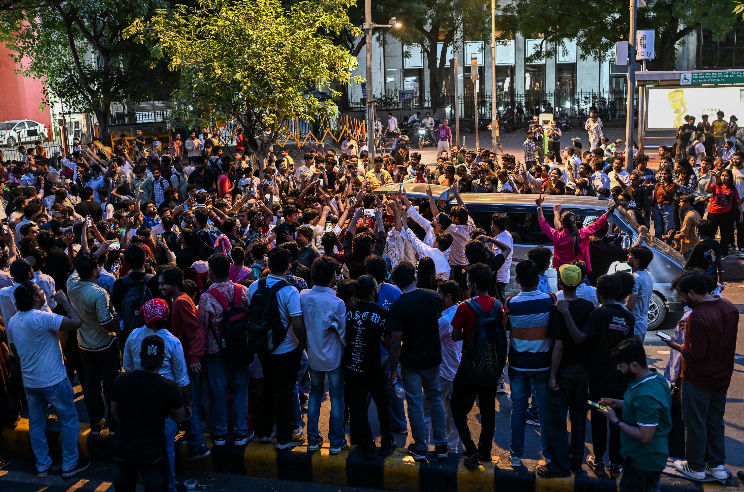 Protesters celebrate at Jantar Mantar after reports of the resignation of Indian Education Minister Dharmendra Pradhan on 25 July 2026 in New Delhi, India