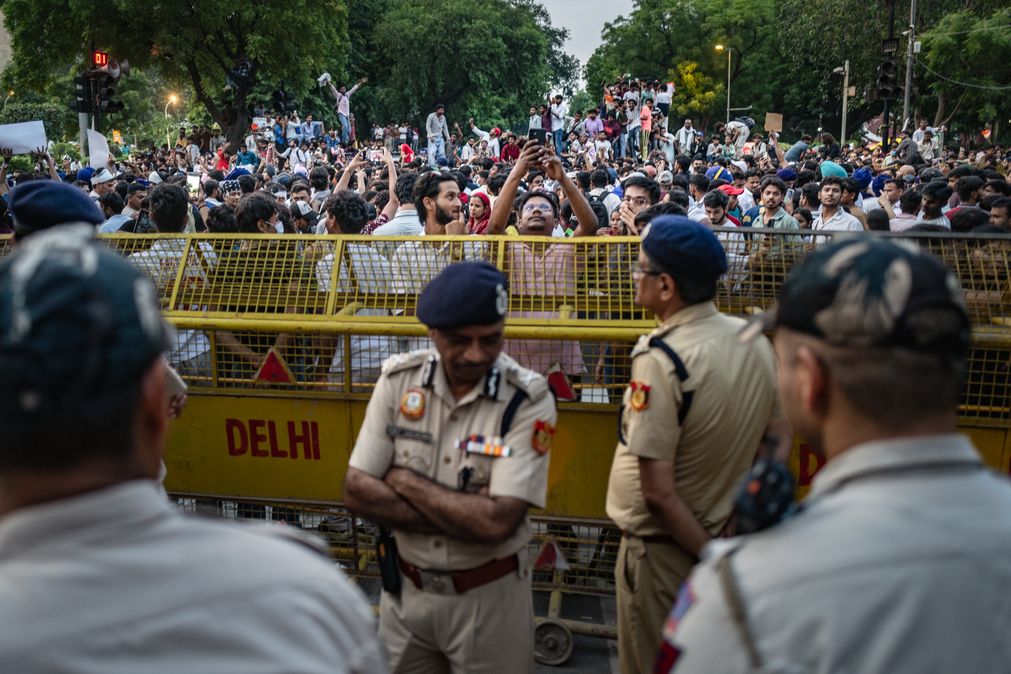 rmed forces enforce movement restrictions of celebrating demonstrators of India's Cockroach Janta Party (CJP), after days demanding the resignation of education minister Dharmendra Pradhan