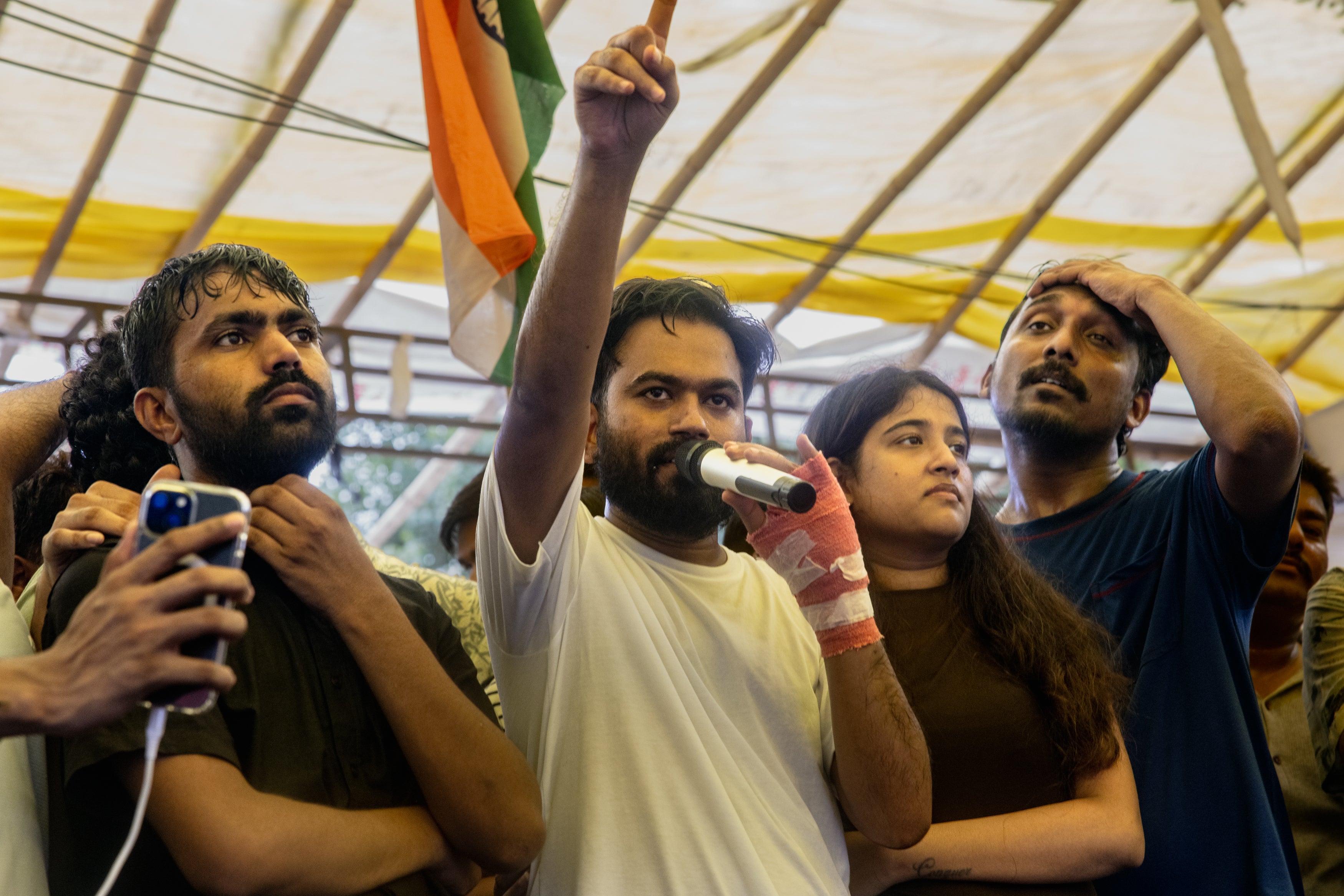 Abhijeet Dipke, founder of India's Cockroach Janta Party (CJP), addresses celebrating supporters following the resignation of Education Minister Dharmendra Pradhan, after days of protests demanding he step down over the alleged Neet examination paper leak scandal on 25 July 2026