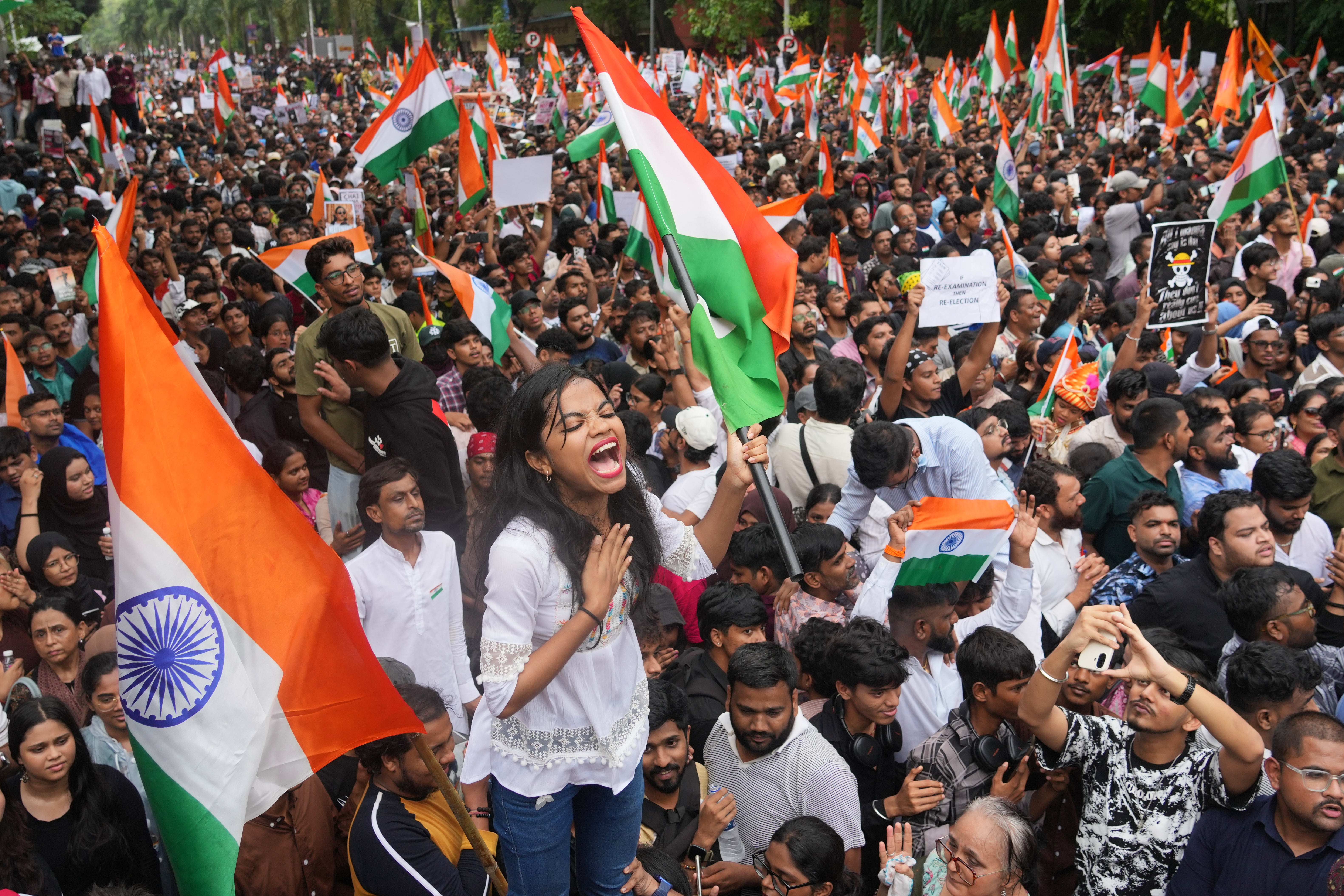 Protesters celebrate after Education Minister Dharmendra Pradhan resigned following nationwide protests as part of the Cockroach Janta Party's protest movement in Mumbai, India, Sunday, 26 July 2026