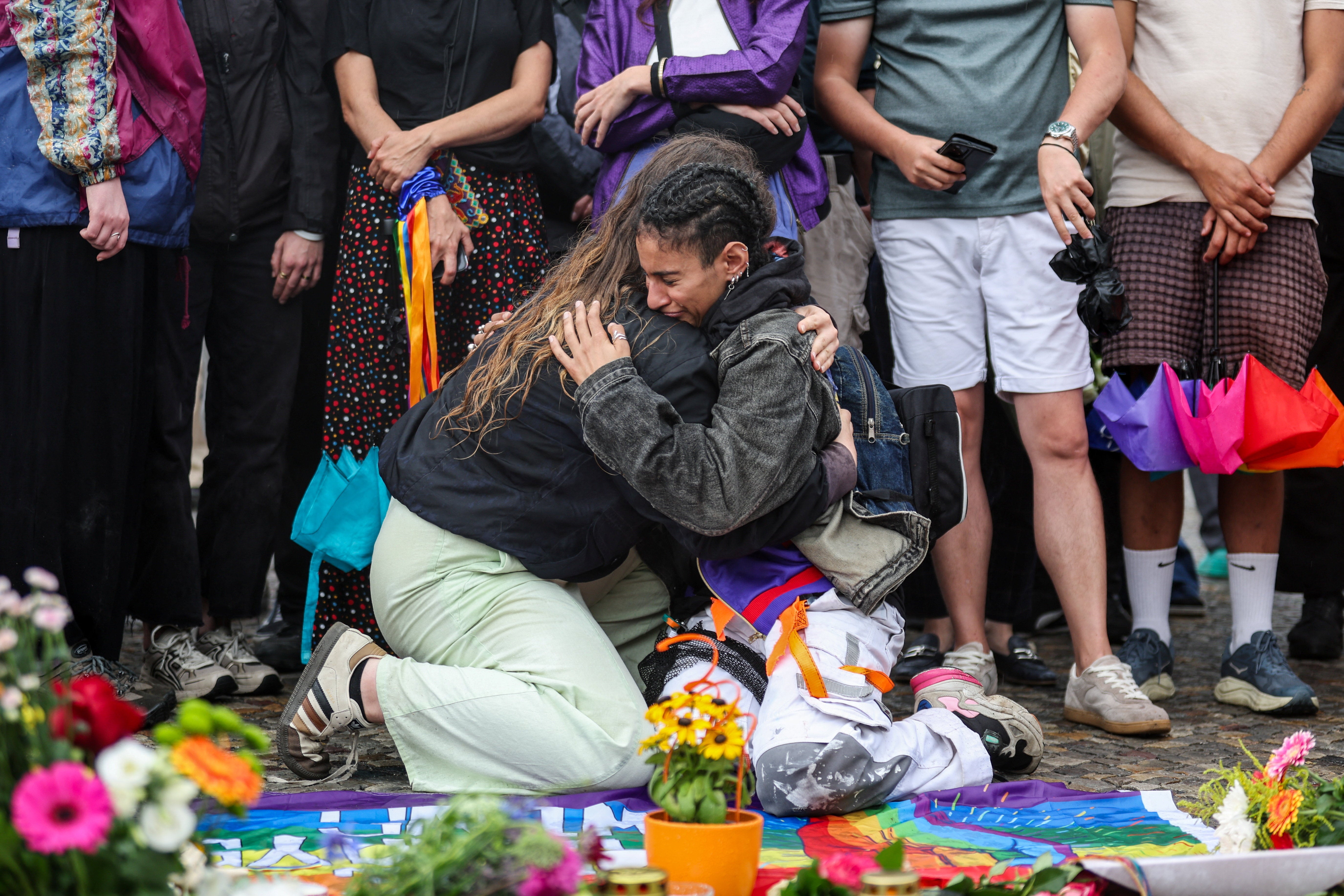 There were emotional scenes as crowds gathered in the wake of the attack (Reuters)