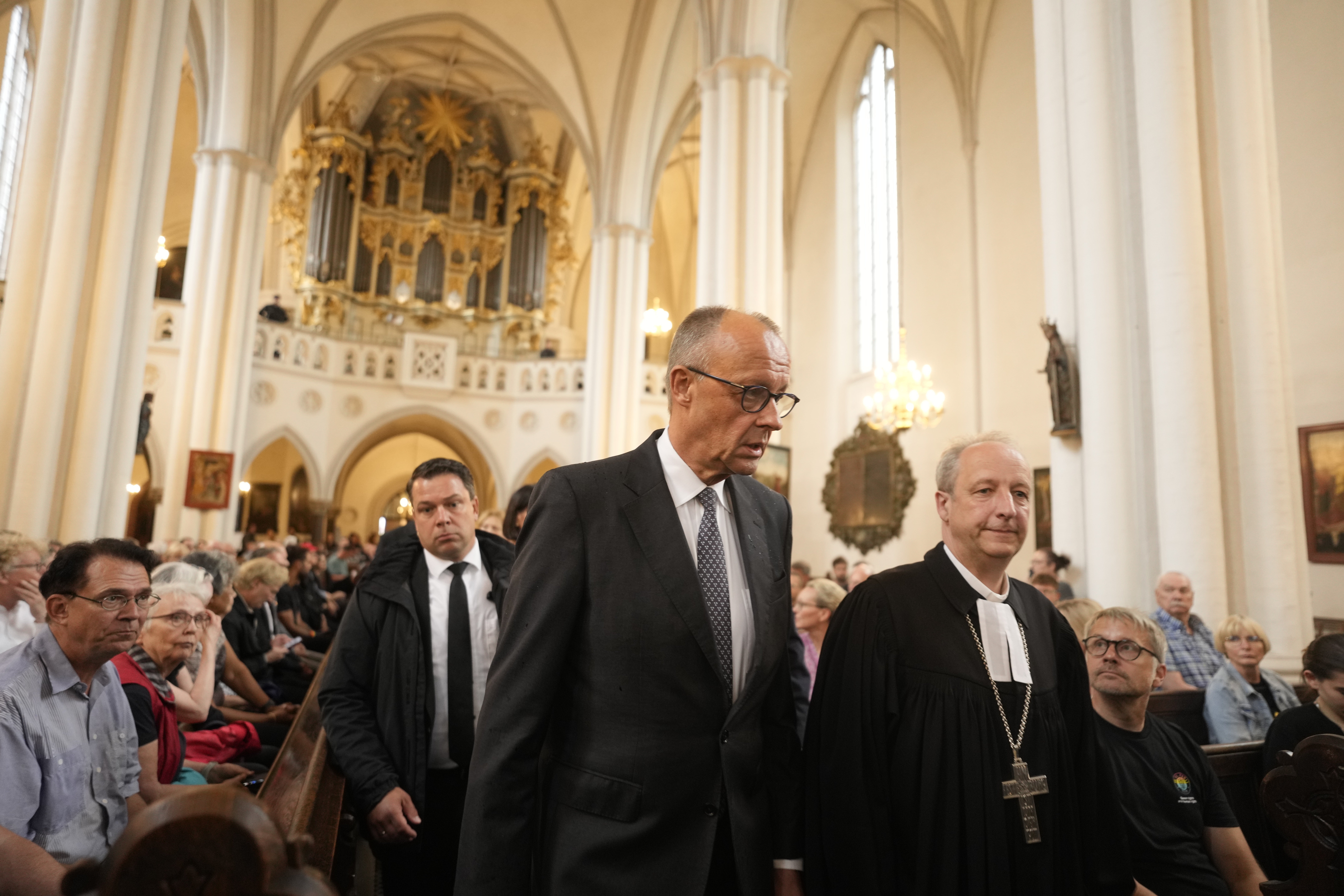 Friedrich Merz arrives at a vigil at St. Marien Church in Berlin (AP)
