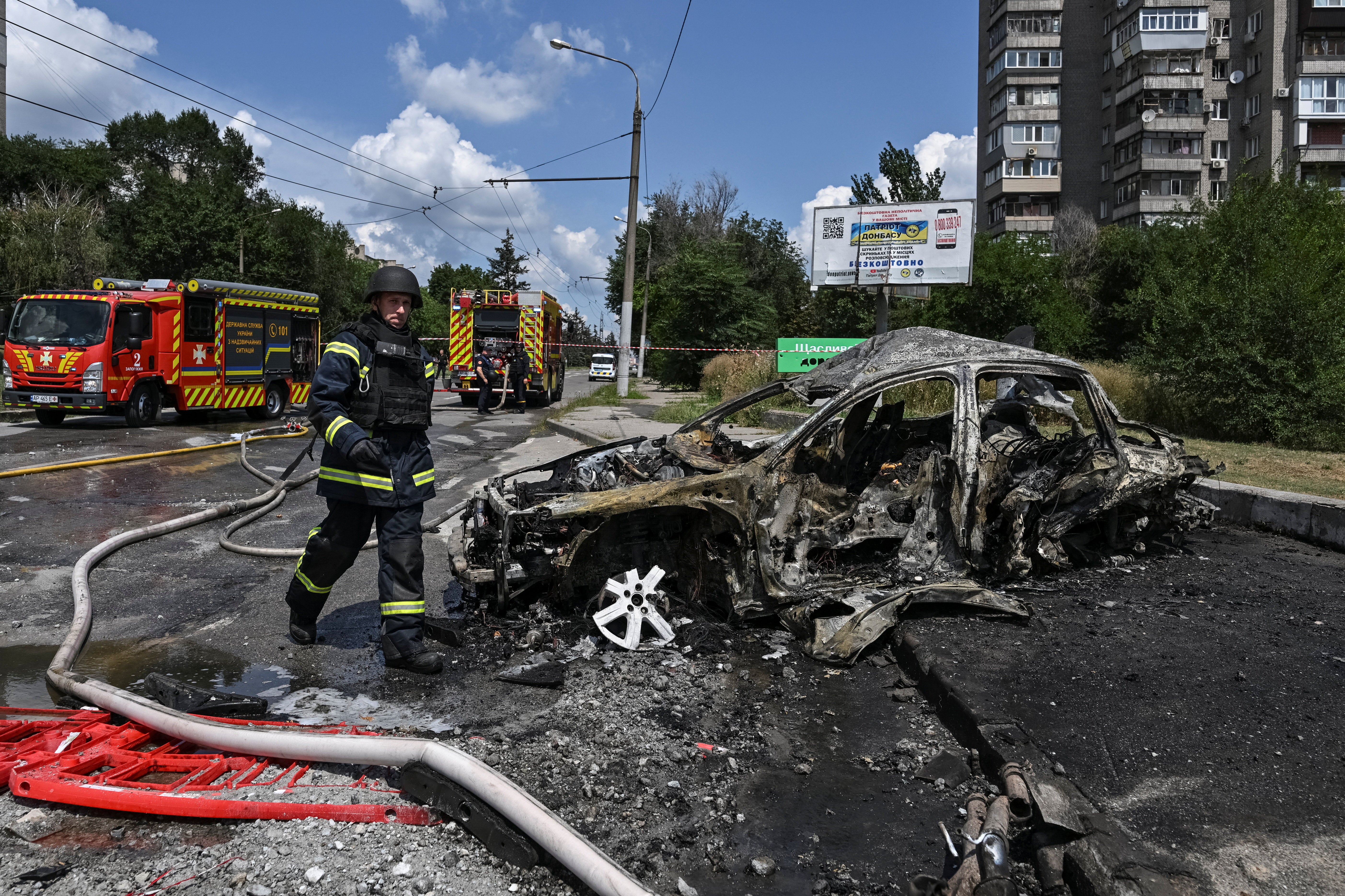 A firefighter walks at the site of a petrol station hit by a Russian airstrike, amid Russia's attack on Ukraine, in Zaporizhzhia