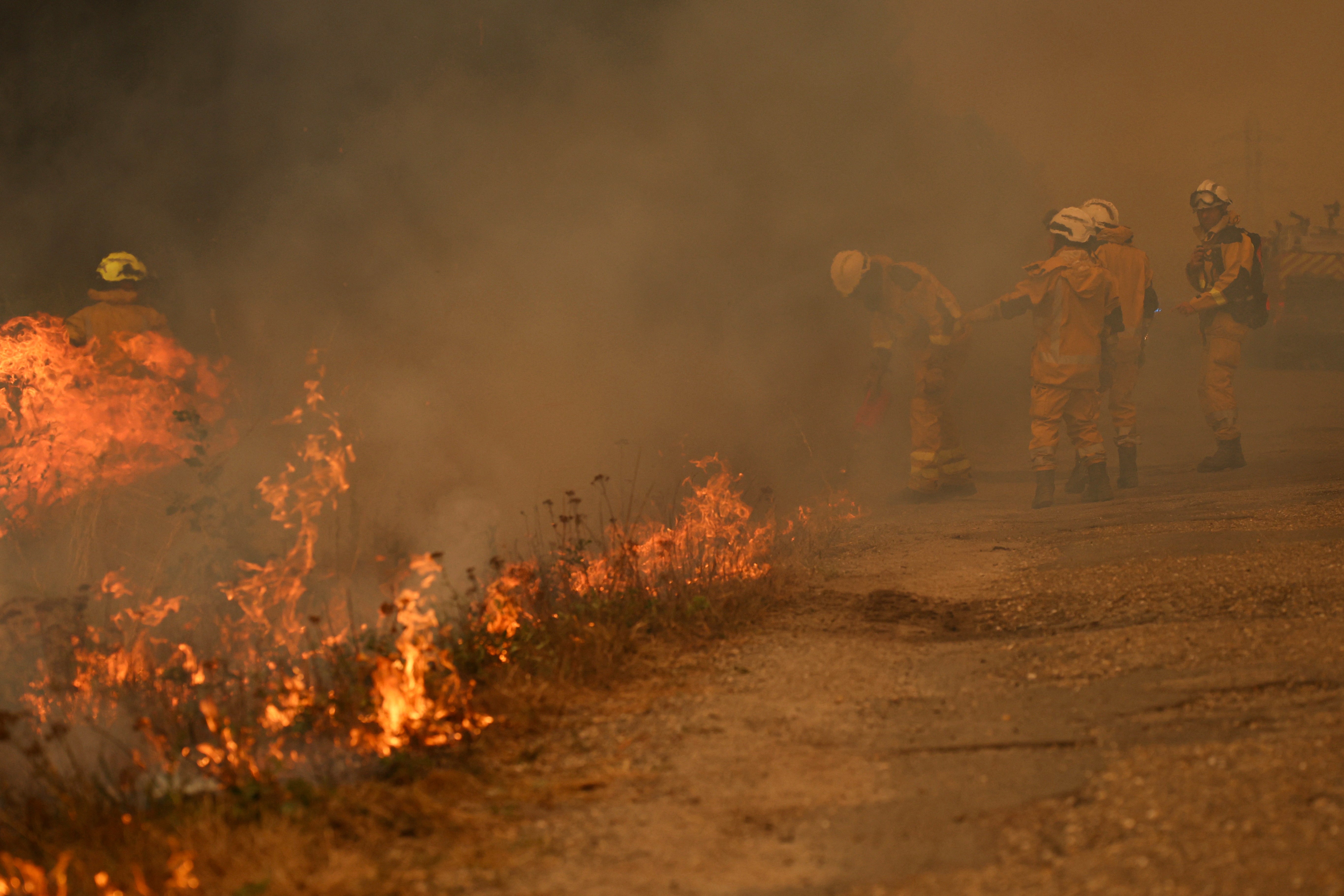 Firefighters burn vegetation to create a fuel-free buffer zone as they fight a huge wildfire in Marcheprime, west of Bordeaux (AFP/Getty)
