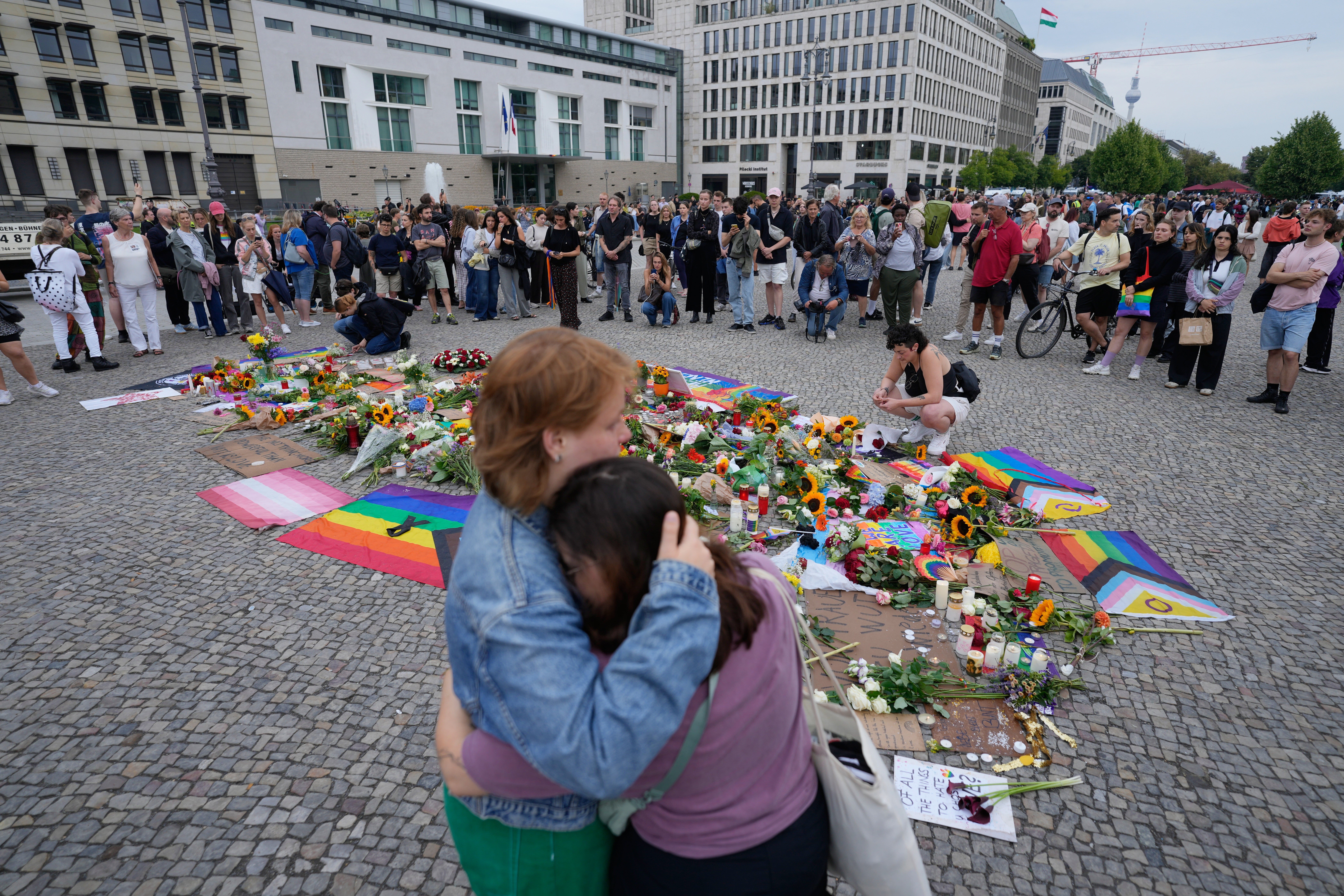 Devastated crowds gather at the Brandenburg Gate in Berlin for a demonstration in support of the LGBTQ+ community