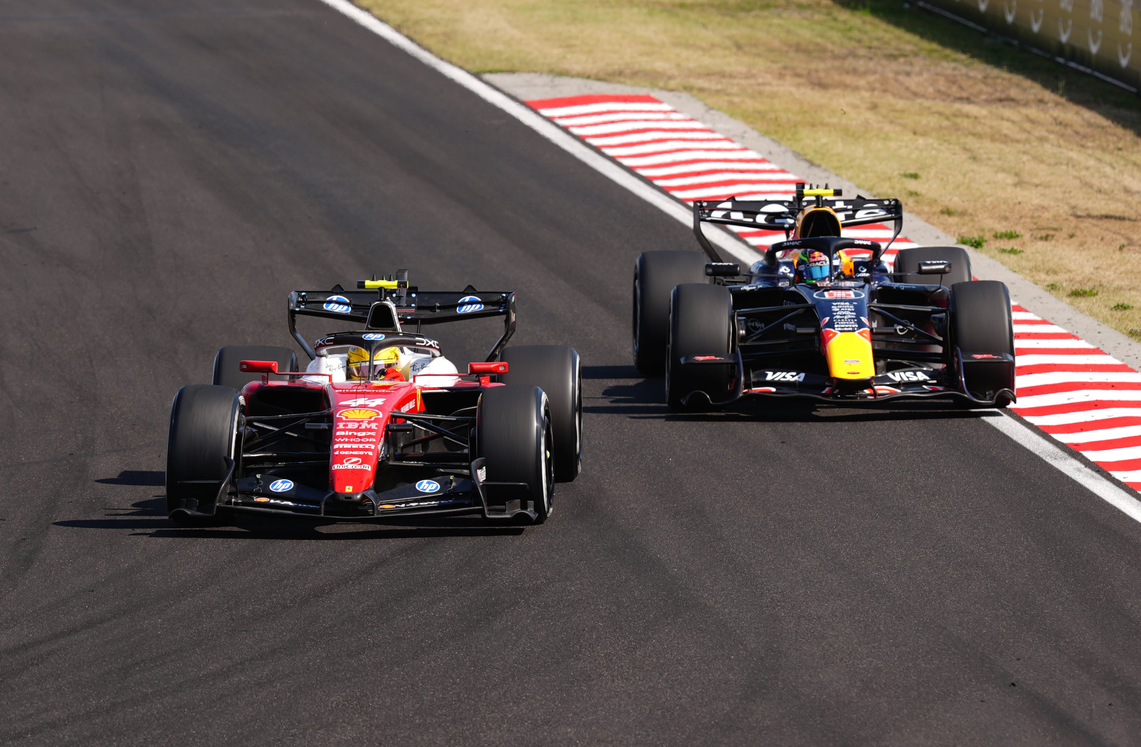 Hamilton passes Red Bull driver Isack Hadjar into turn one (David Davies/PA) (PA Wire)