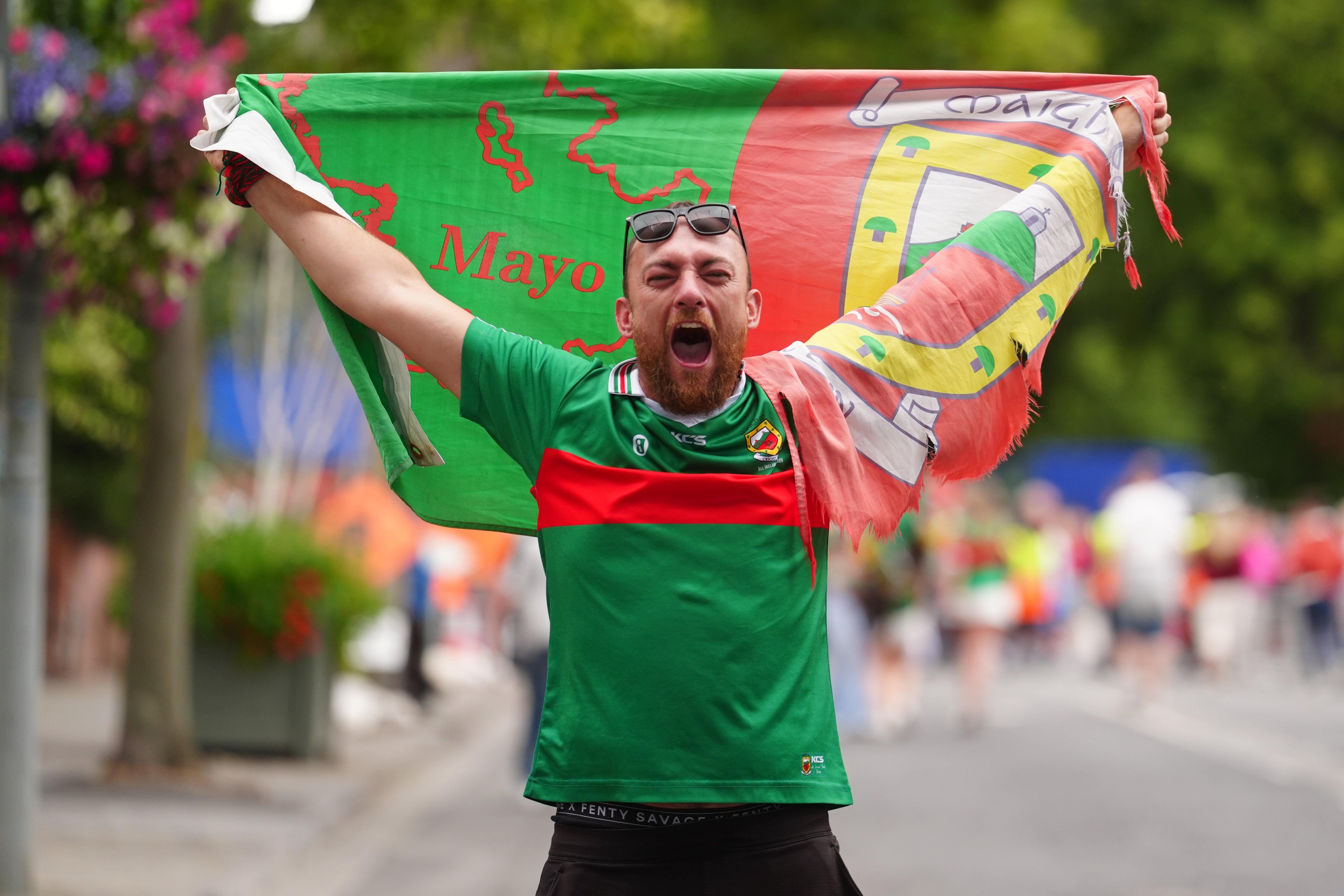 Mayo supporters celebrate outside Croke Park stadium after Mayo beat Kerry in the All-Ireland Senior Football Championship final, the team's first win since 1951