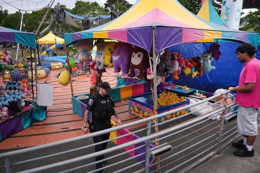 Seattle Police have said that the two people responsible may have been shooting at each other, not aiming for visitors to the food festival (AP)
