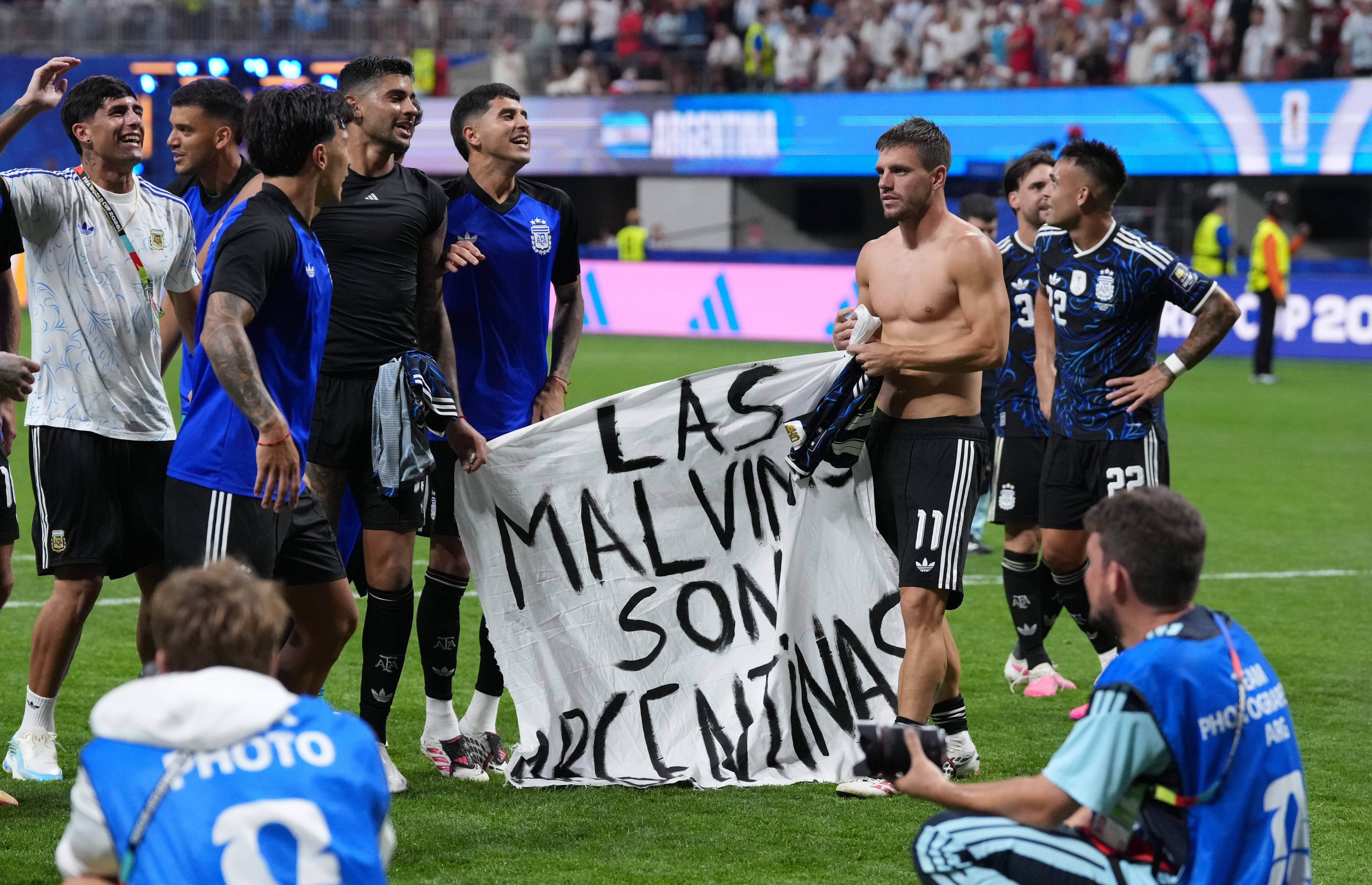 Argentina players celebrated with a banner referencing the Falklands conflict following victory over England (Nick Potts/PA)