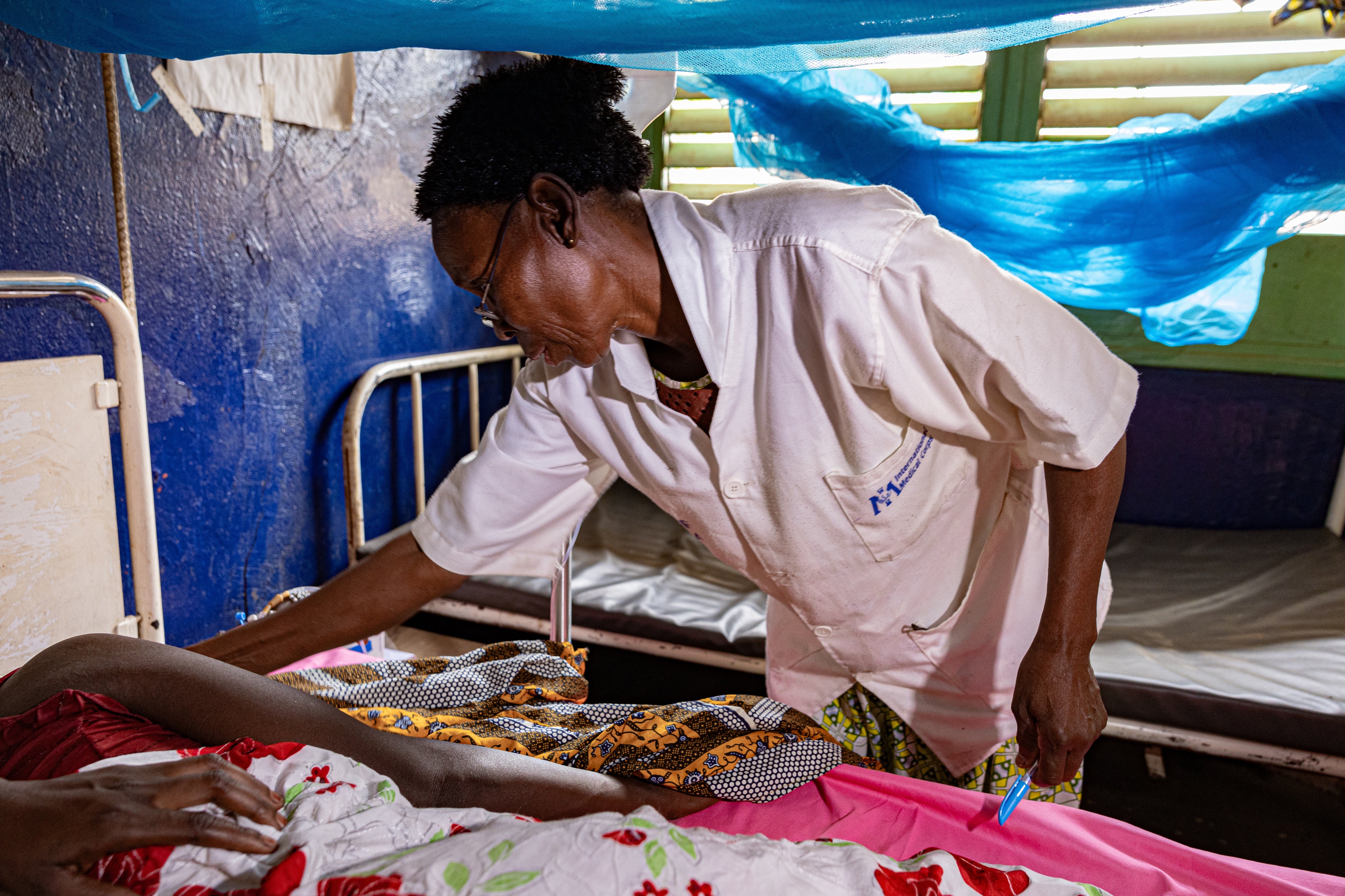 Delphine Zanaba a nurse tends to a mother who just lost her baby at nine months and nearly died herself - Central African Republic