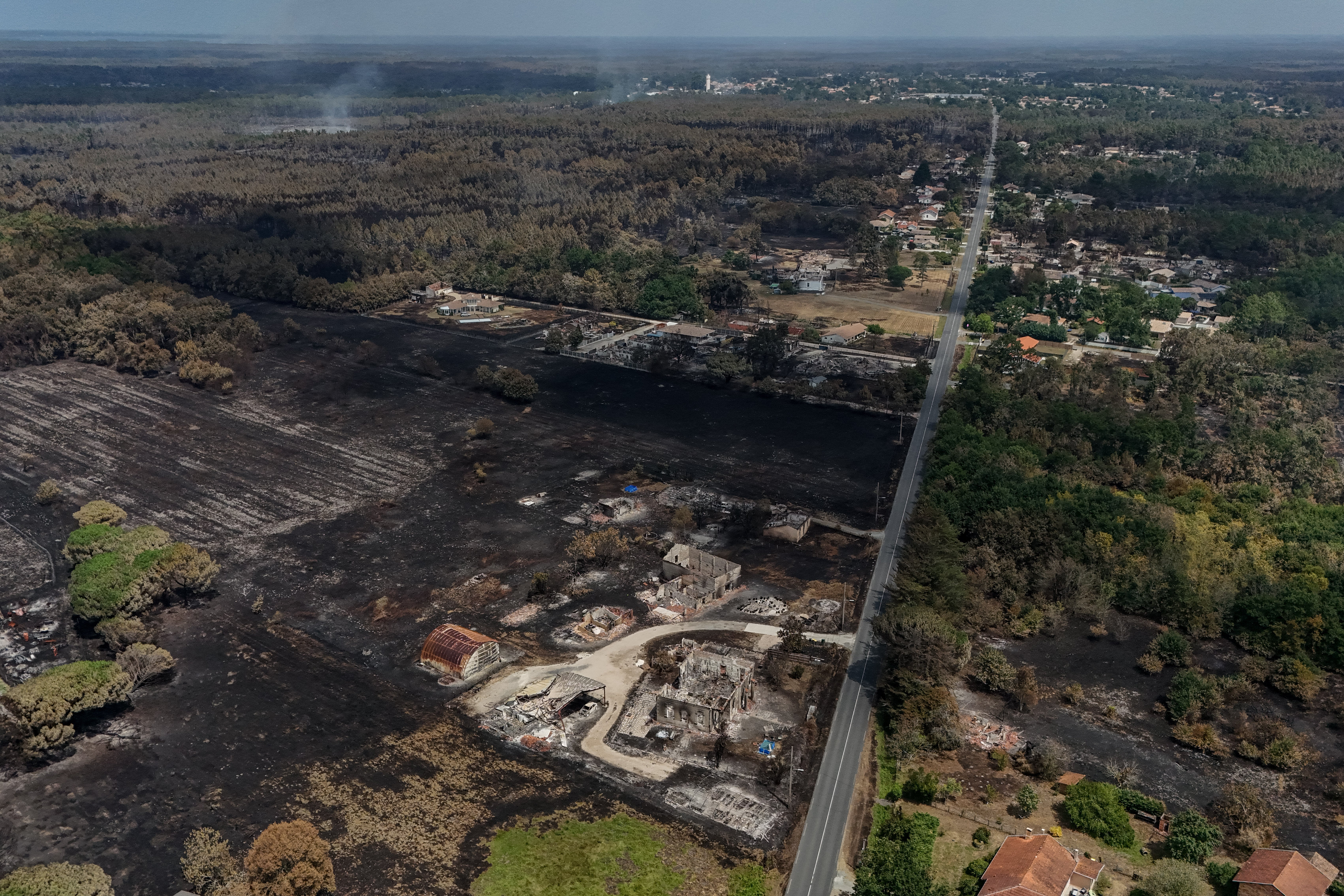 This aerial view shows damaged houses in a burnt area in the French town of Le Porge (AFP/Getty)