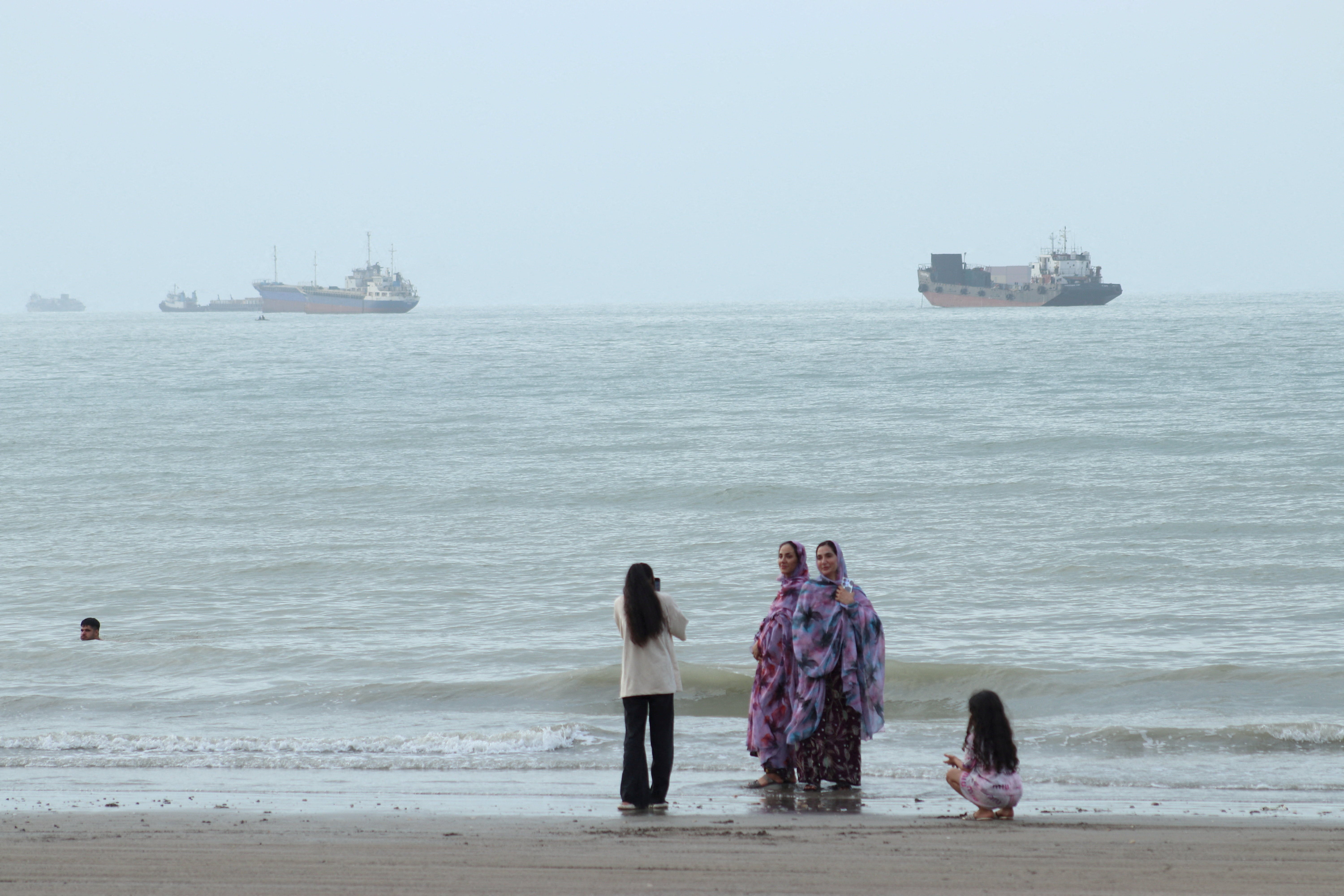Vessels in the Strait of Hormuz near the beach of Bandar Abbas in Iran on July 27 (Reuters)