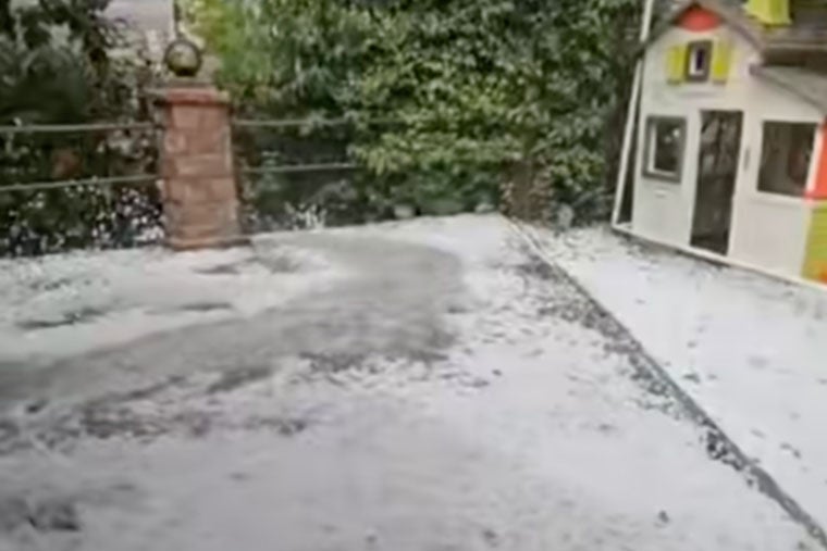 The snowfall was accompanied by violent downpours that battered the rest of the country