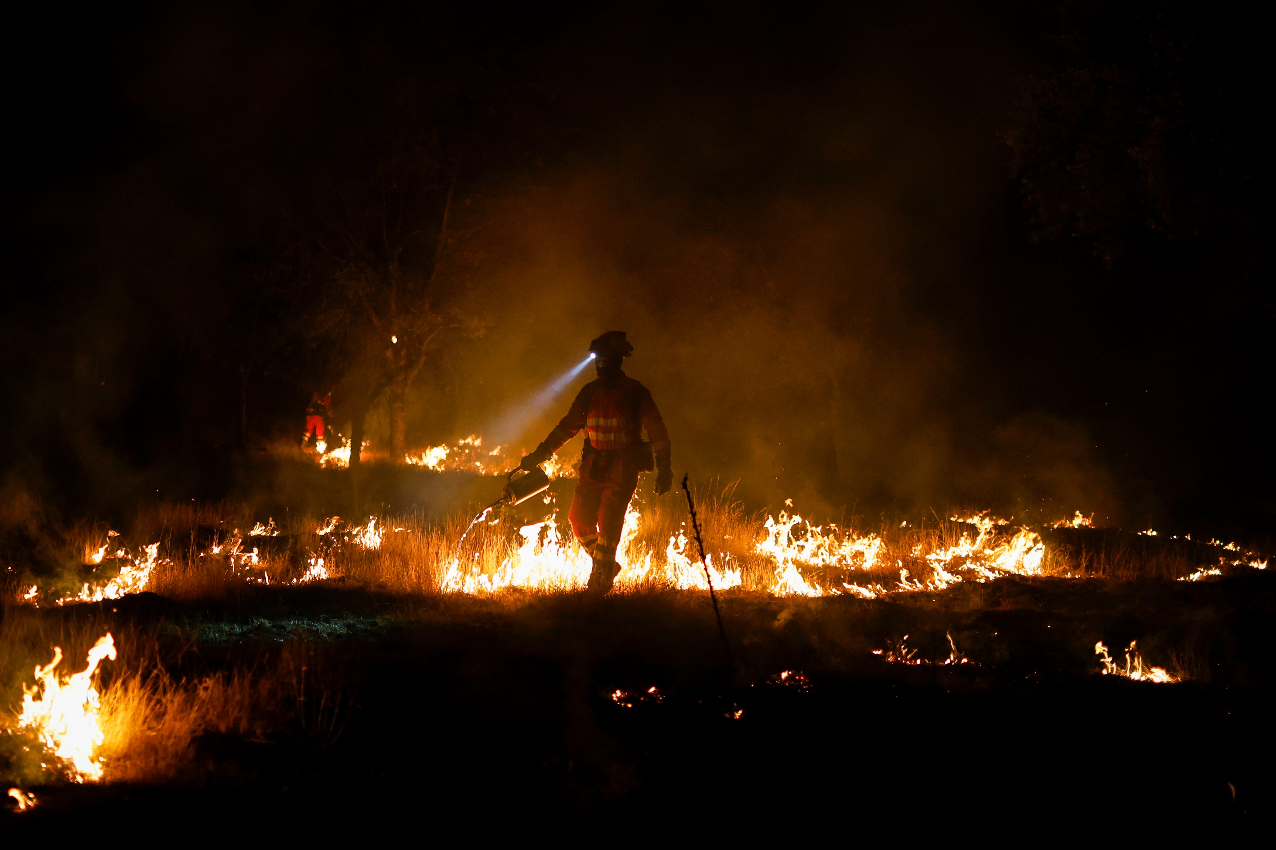 Firefighters battle a blaze in Madrid (Getty)