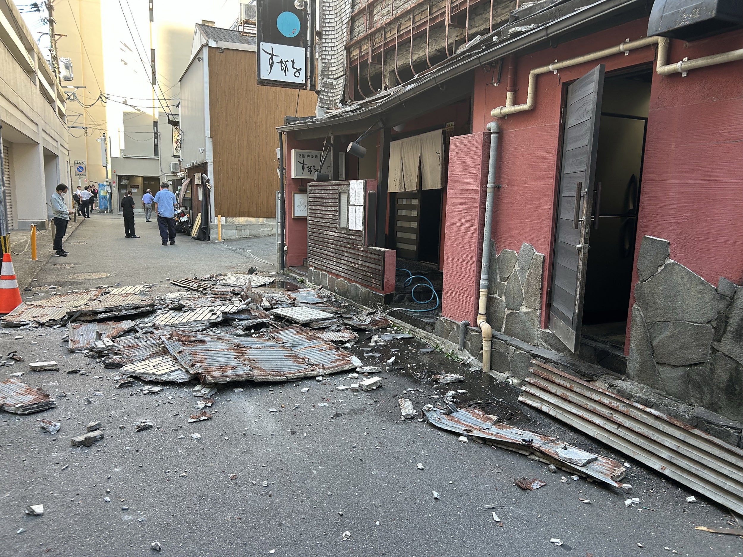 The exterior wall of a shop is seen collapsed in an earthquake, in Kumamoto City (AFP/Getty)