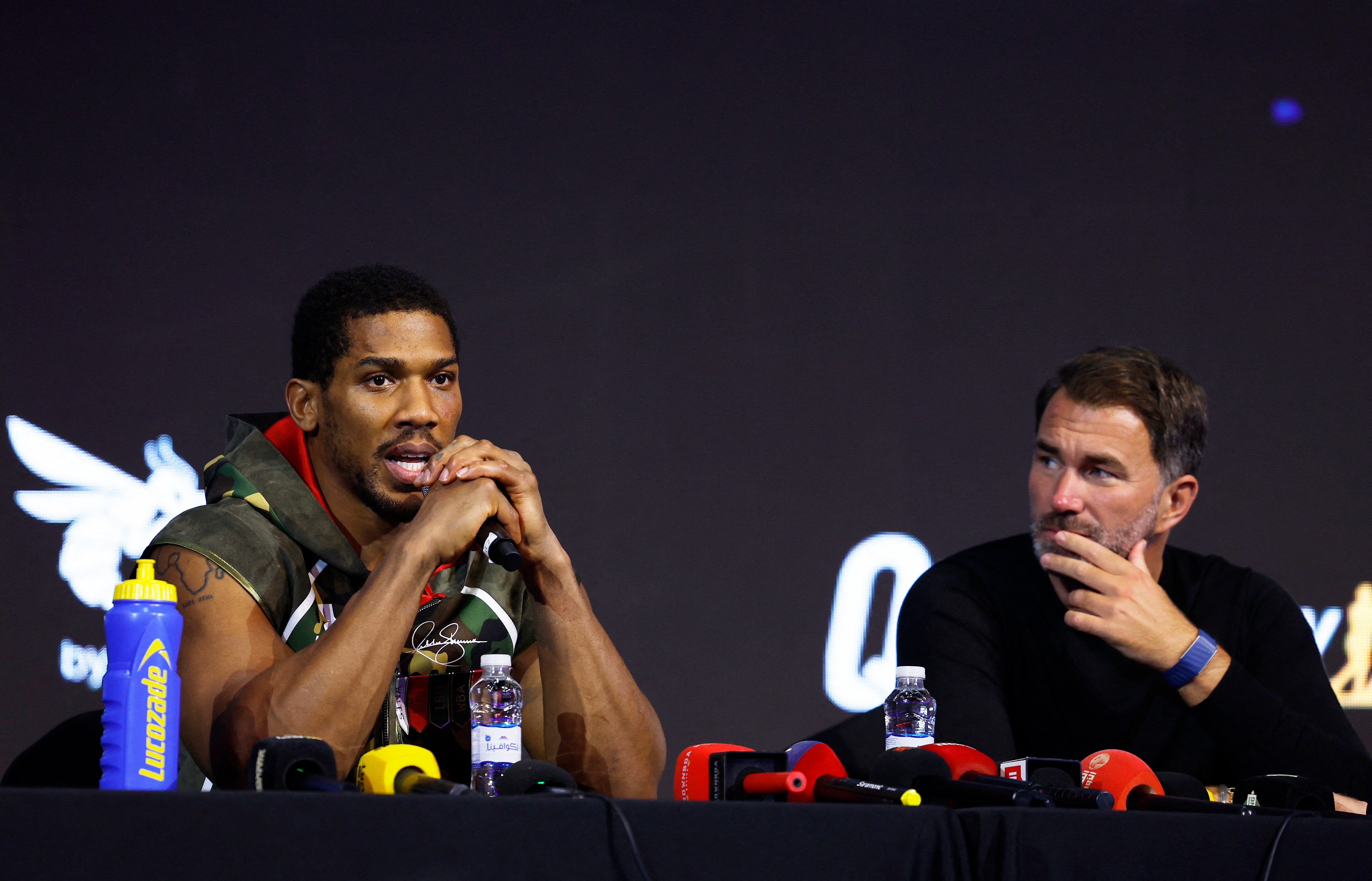 Joshua with his promoter Eddie Hearn at Saturday’s post-fight press conference
