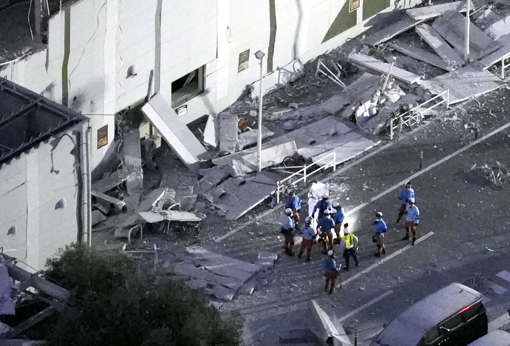 Rescue workers conduct a search and rescue operation at the damaged shopping mall