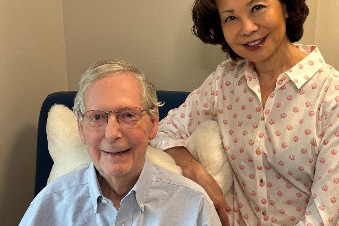 Mitch McConnell and his wife, former Trump cabinet secretary Elaine Chao, in his latest ‘proof-of-life’ photo, released this week (Reuters)