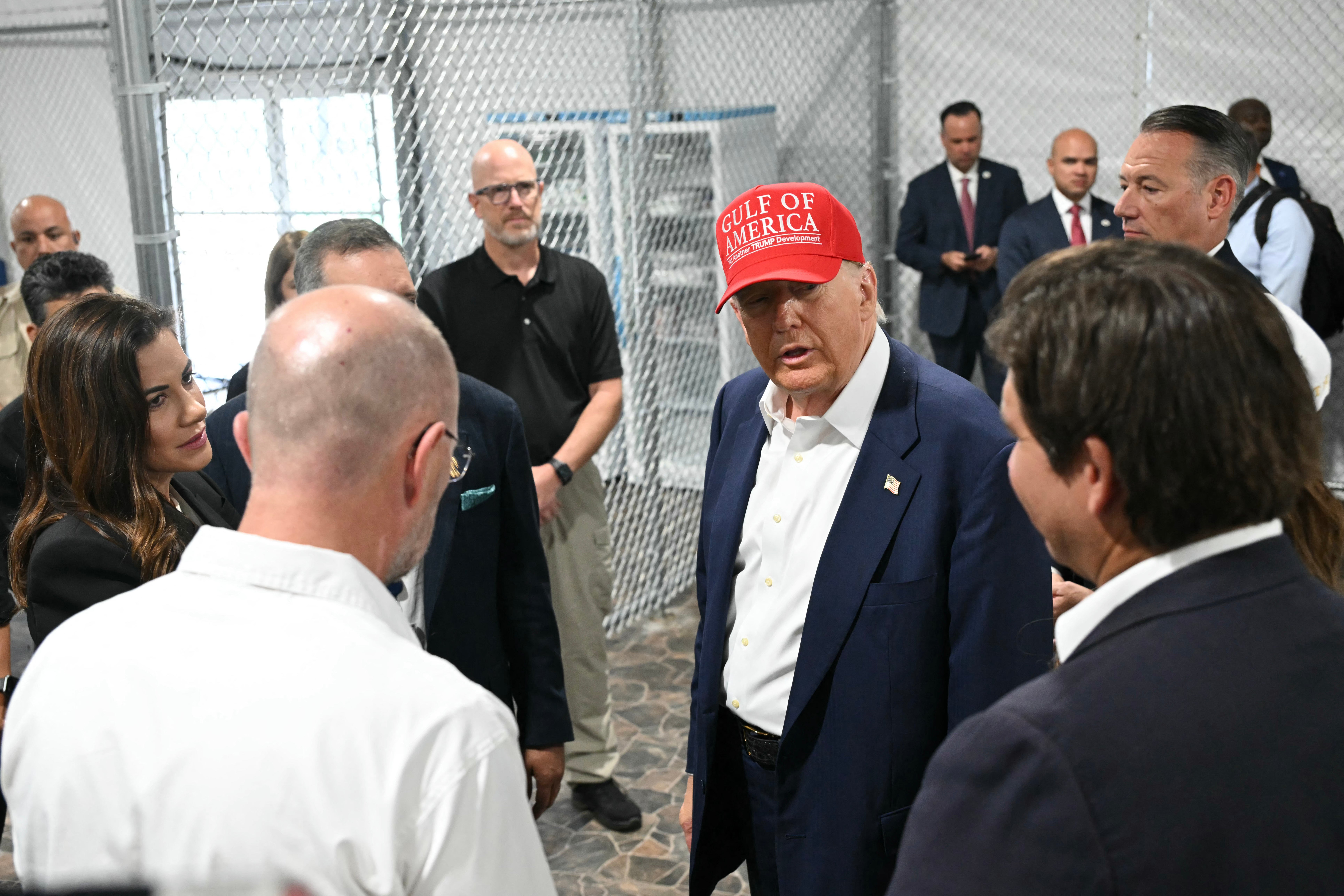 Trump (centre), Florida Governor Ron DeSantis (right), and secretary of Homeland Security Kristi Noem (not pictured) tour a migrant detention centre, dubbed &lsquo;Alligator Alcatraz&rsquo;