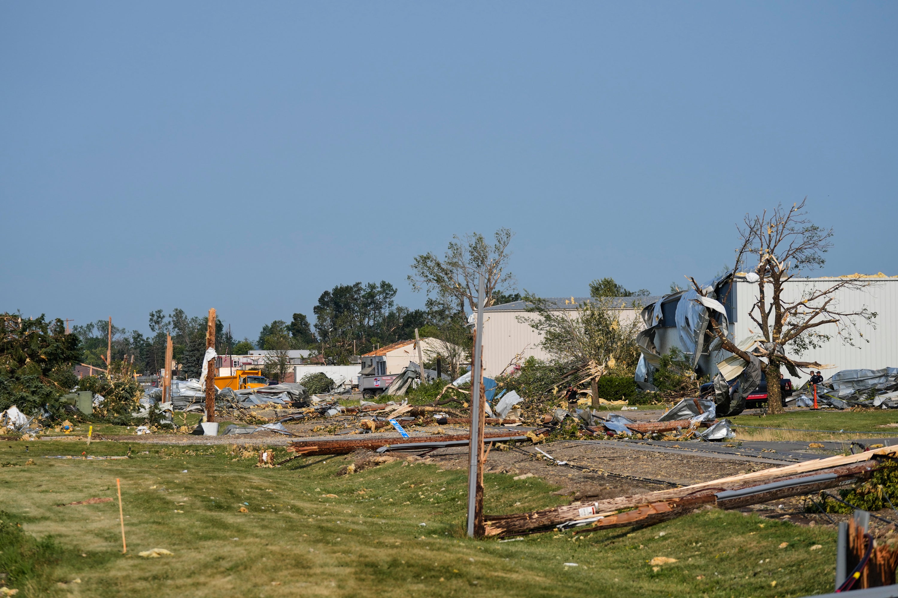 It hollowed out homes, tossed around cars and toppled power lines (AP Photo/Kayla Wolf)