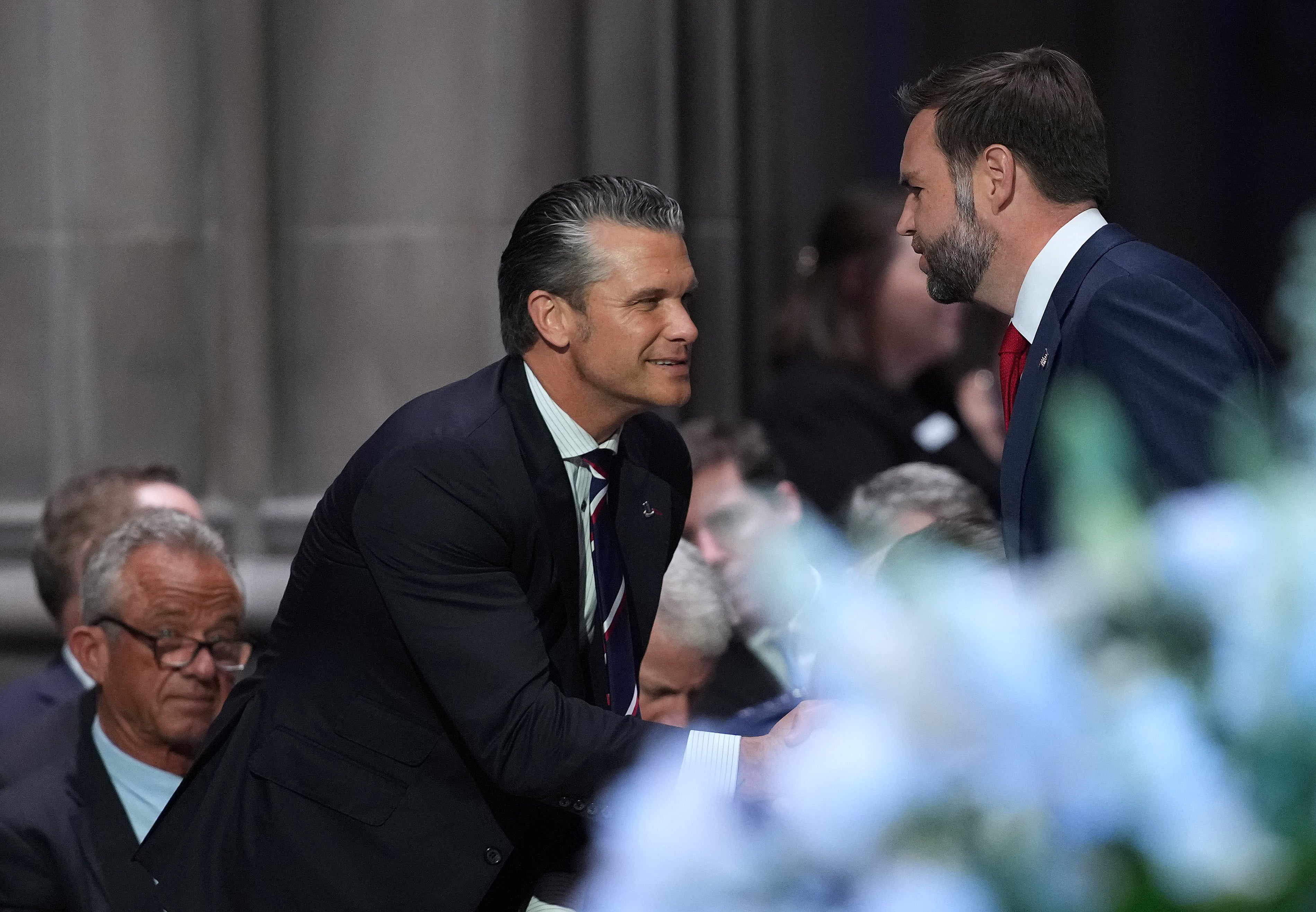 Secretary of War Pete Hegseth greets Vice President JD Vance at the funeral service for the late Sen. Lindsey Graham