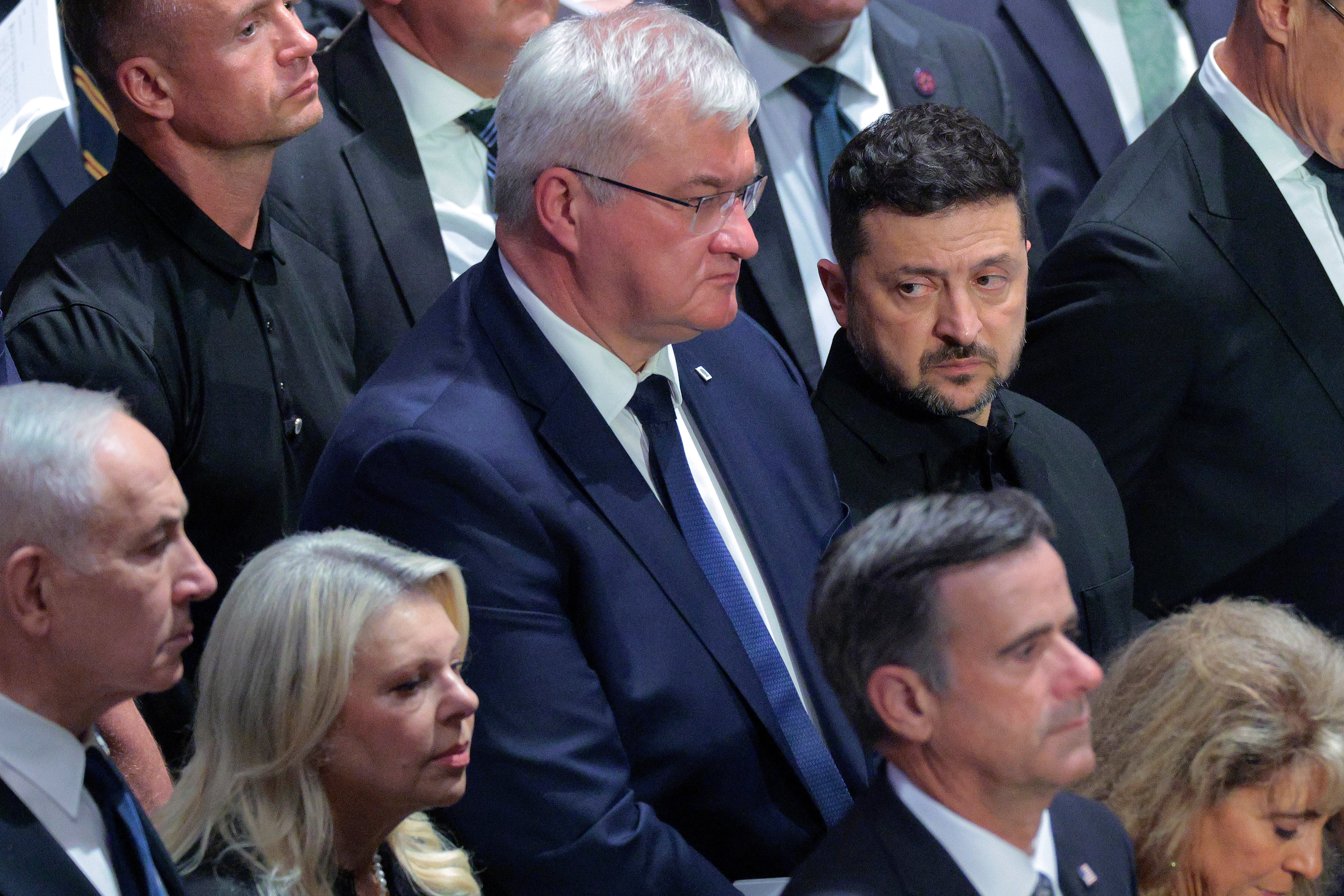 Ukrainian Foreign Minister Andrii Sybiha and Ukrainian President Volodymyr Zelensky attend the funeral service for the late US Senor Lindsey Graham at the Washington National Cathedral on Tuesday (Getty)