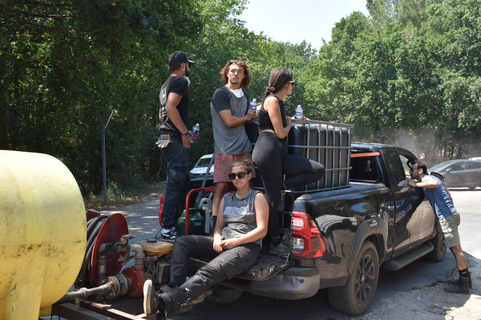 A pick-up truck with water and volunteers ready to circle the forests and scout for break-out fires