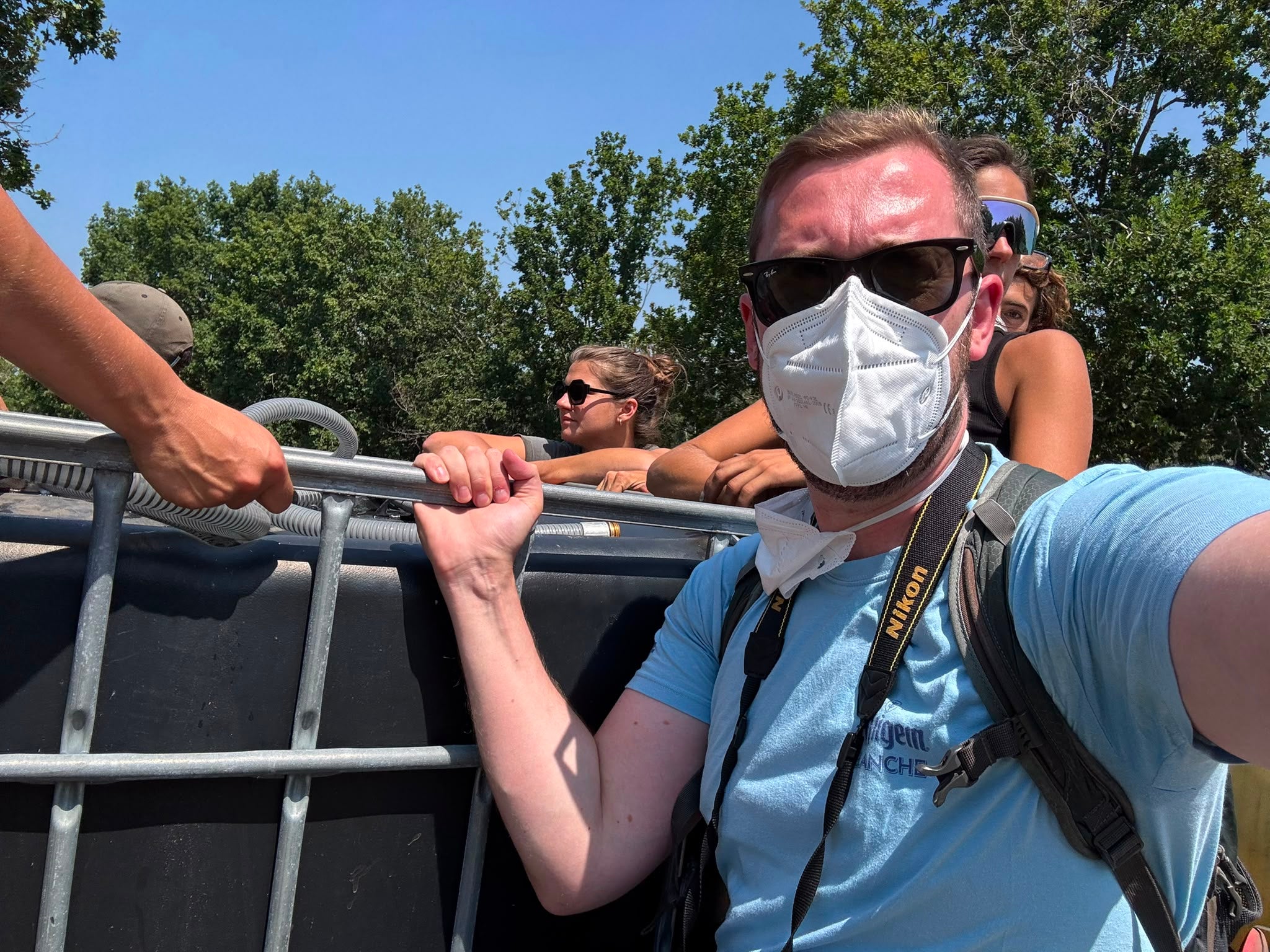 Clinging to a water tank on the back of a pick-up truck in the forests around Lacanau, James Reynolds (pictured) joined volunteers on Tuesday on a patrol to spot break out fires