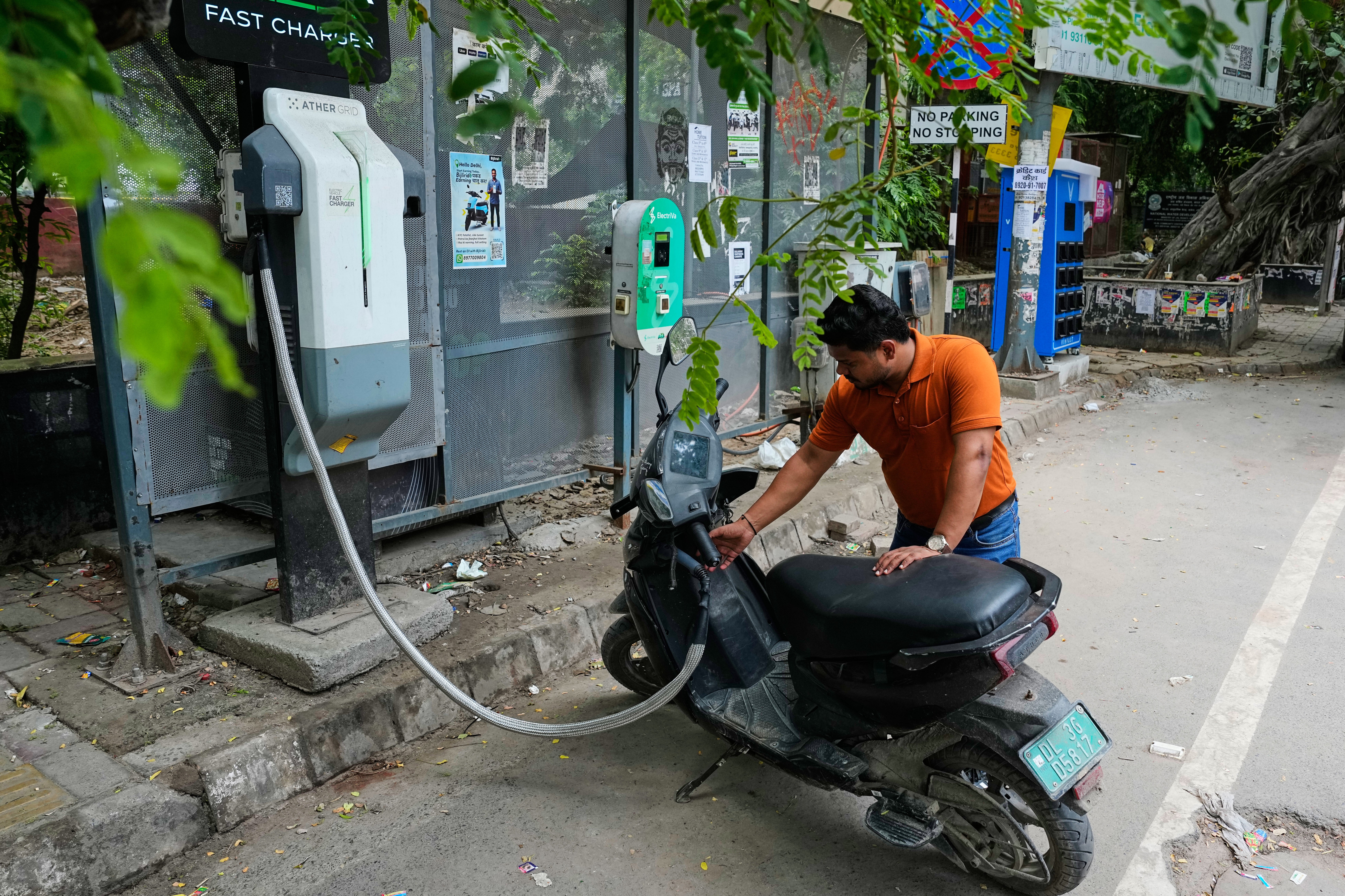 Delhi adopted a new policy on 1 July that aims to make the vast majority of newly registered vehicles electric by 2027 (Associated Press)