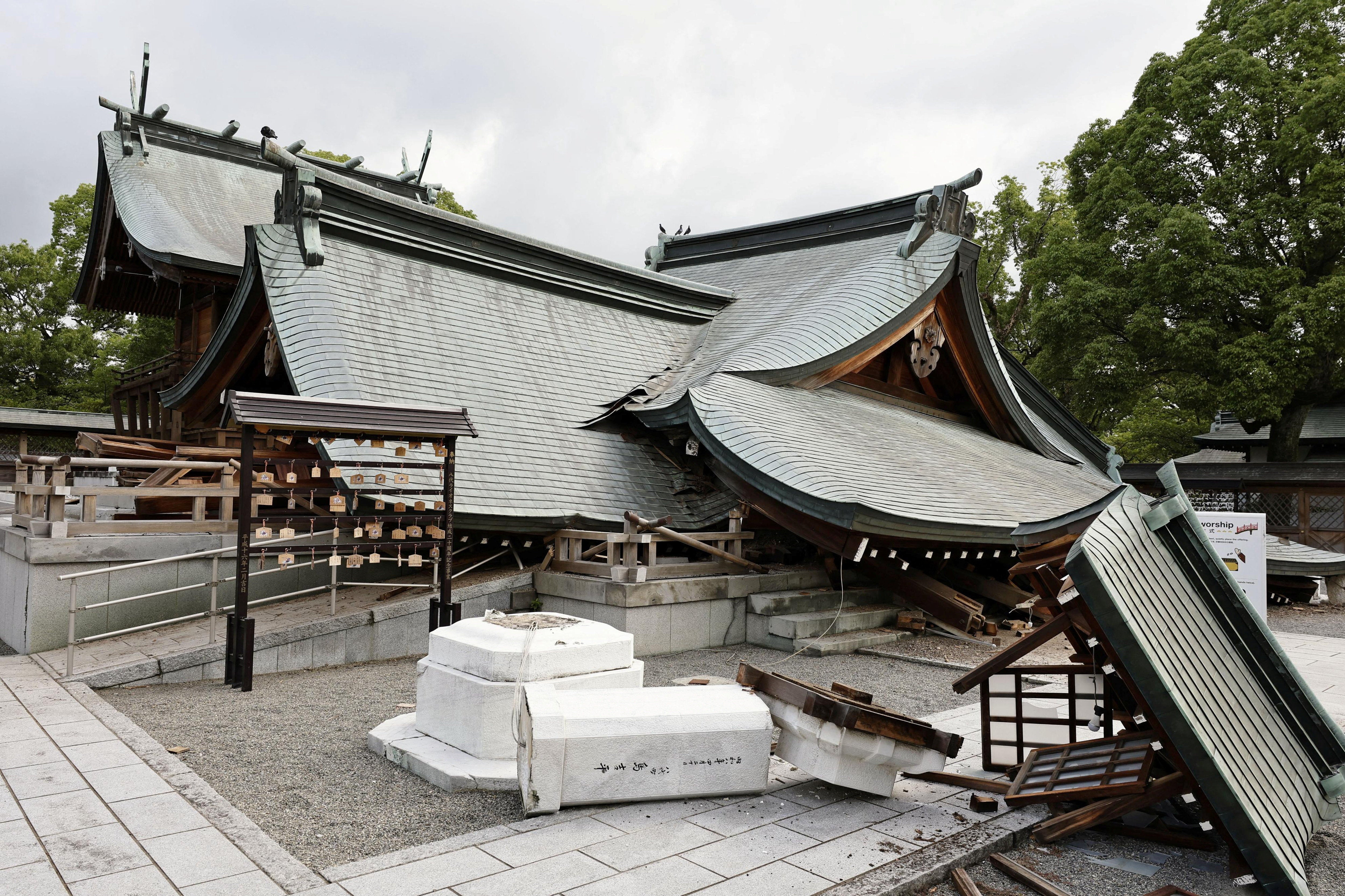 The collapsed worship hall of Yatshushiro Shrine after an earthquake with a magnitude of 7.1 struck Japan's southern Kumamoto prefecture